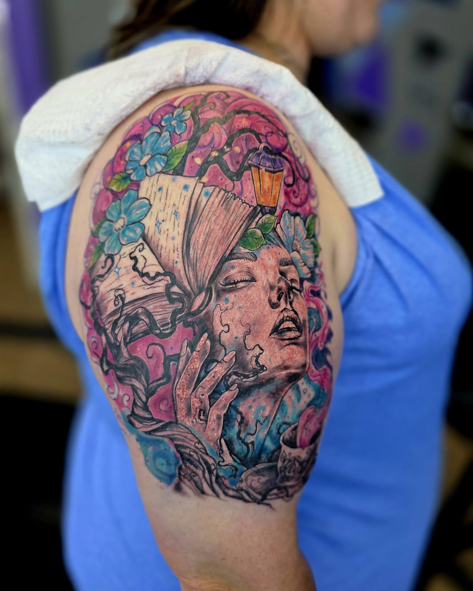 Woman's face with flowers new school tattoo on the shoulder by Jessica DarkRabbit