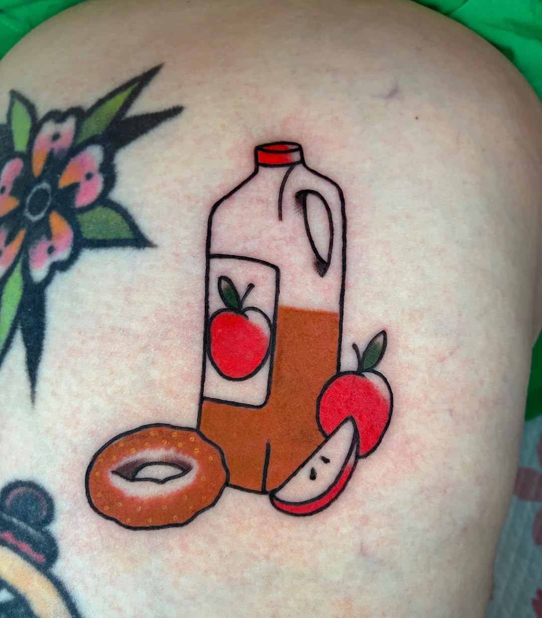 Apple juice American traditional tattoo on the thigh by ๐๐ช๐๐ซ๐ก๐ ๐๐ฏ๐ถ๐ฉ๐