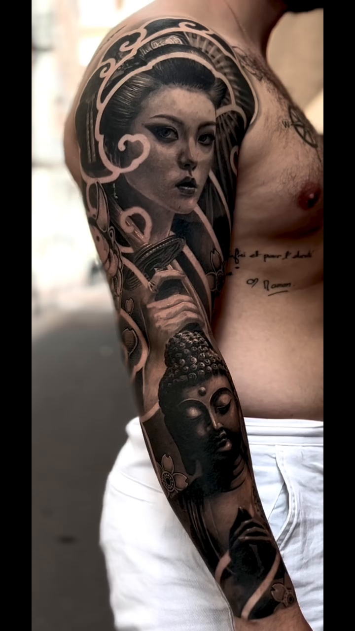 Geisha and Buddha sleeve Japanese tattoo on the upper arm by Eltche Art Tattoo