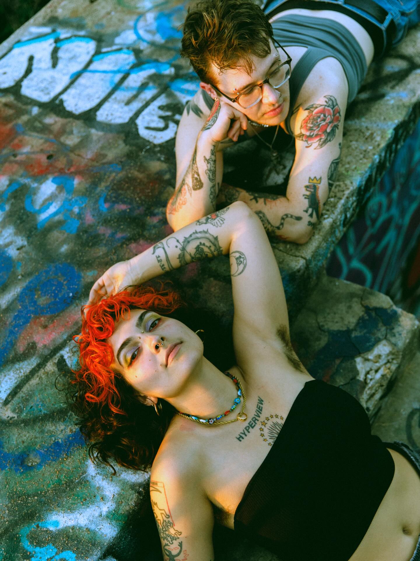 Tattooed couple American traditional tattoo on the upper arm by kane