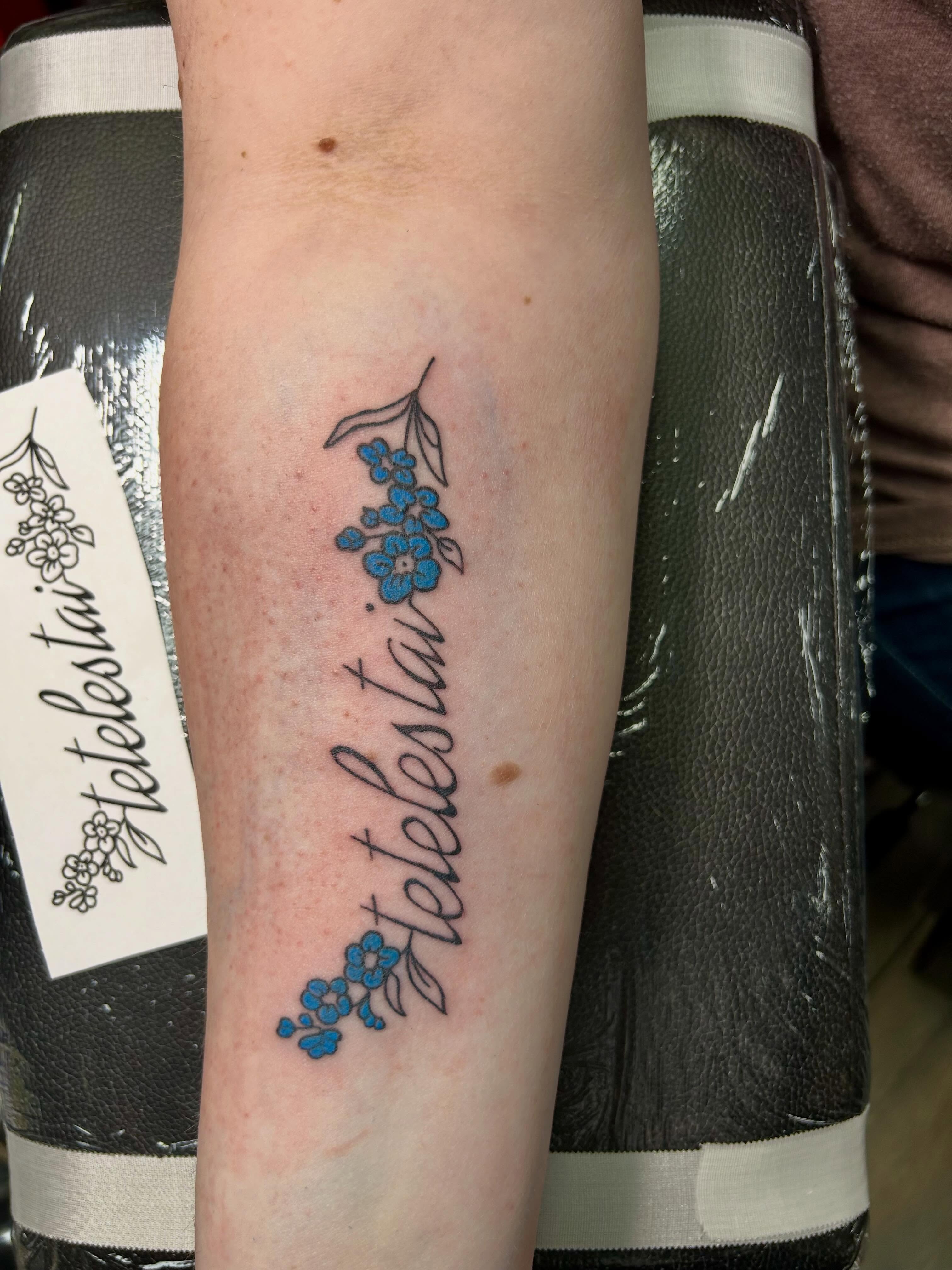 Tetelestai fine line tattoo on the forearm by Bjorn Bjornstad, Dubuque, Iowa