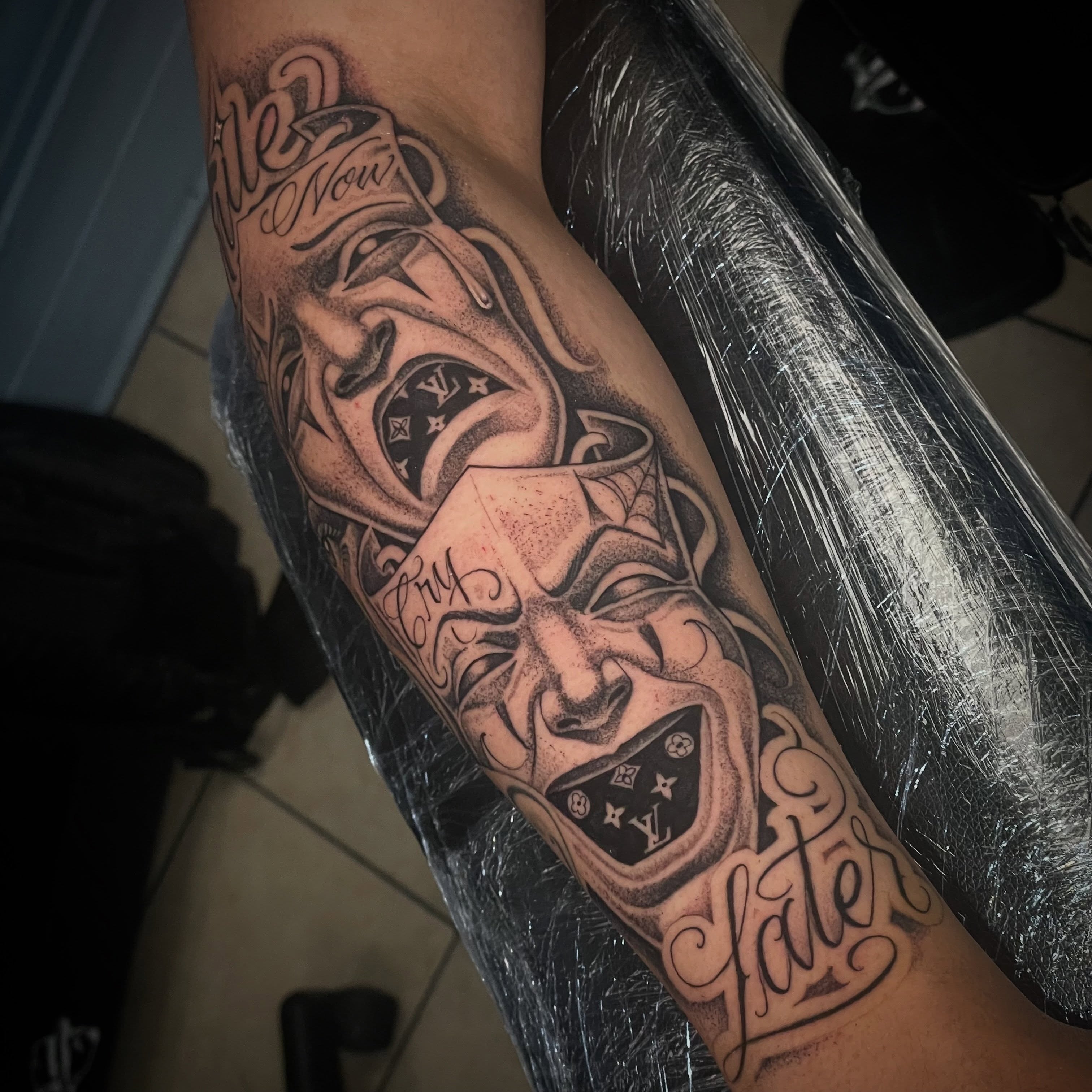 Joker mask American traditional tattoo on the forearm by Shadoww Espinoza