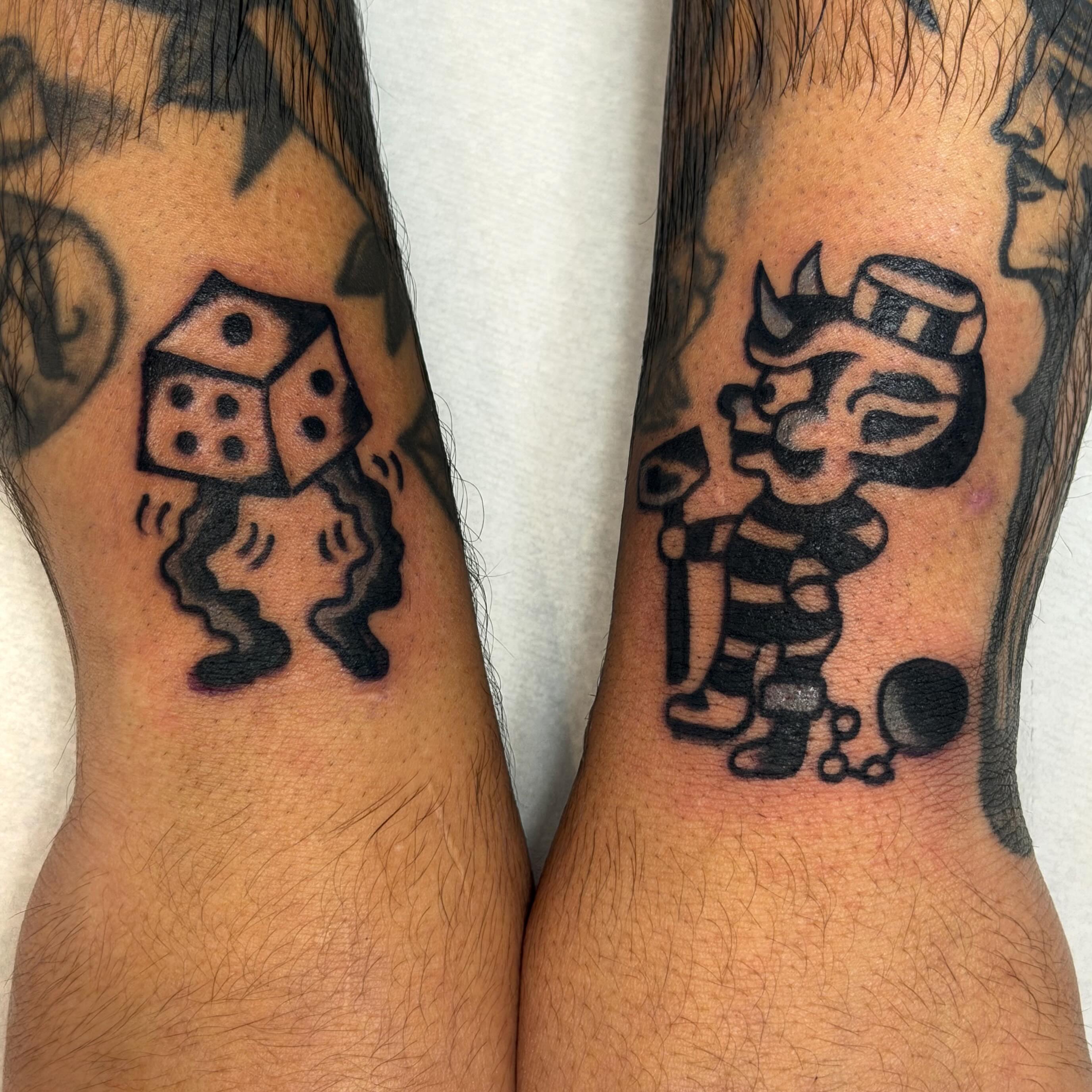 Dice and devil black and grey tattoo on the forearm by Jake