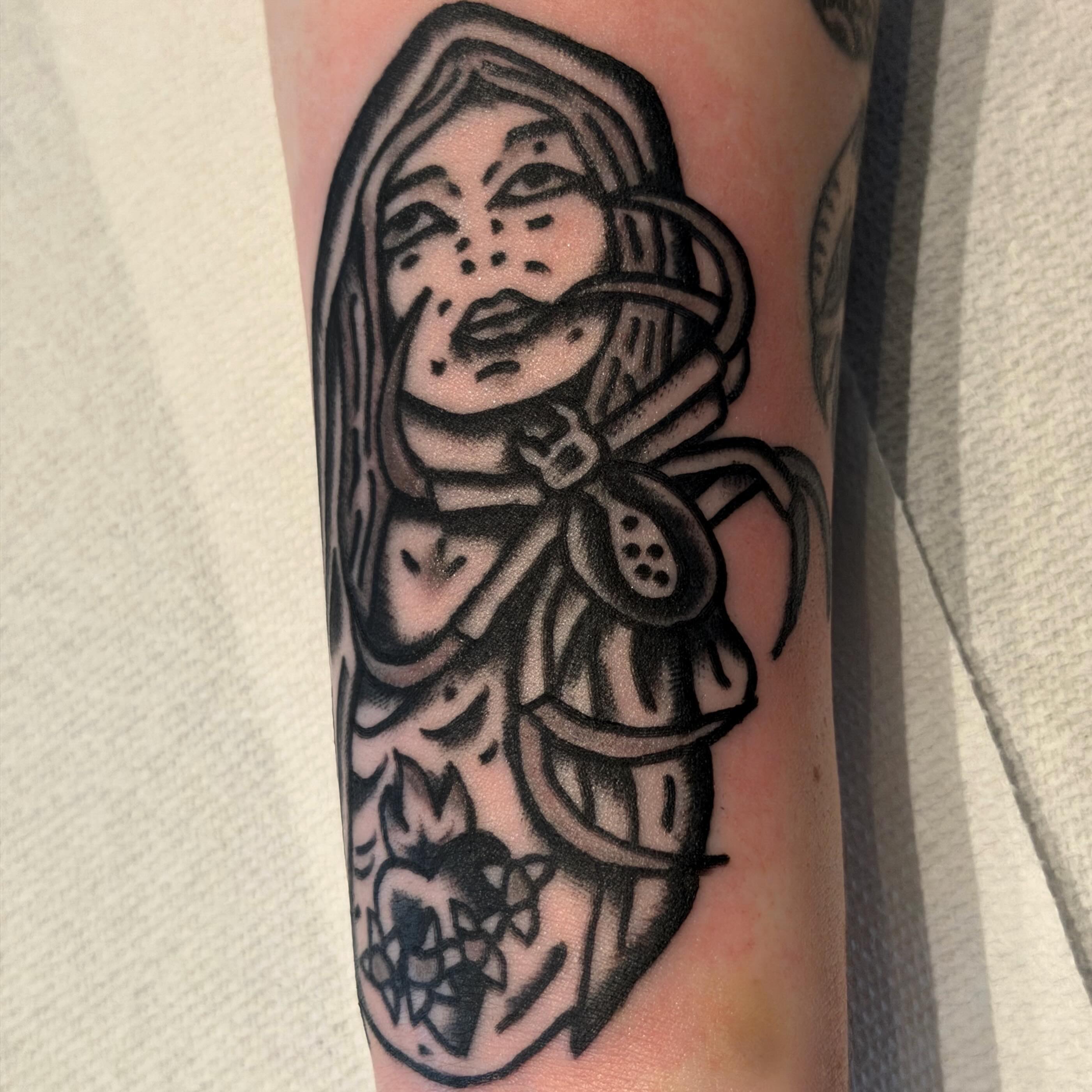 Woman with armor black and grey tattoo on the forearm by Jake