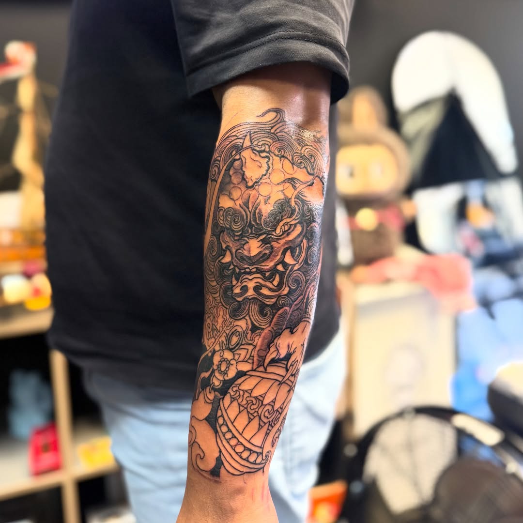 Lion japanese irezumi tattoo on the forearm by Zack Yang, Houston, Texas