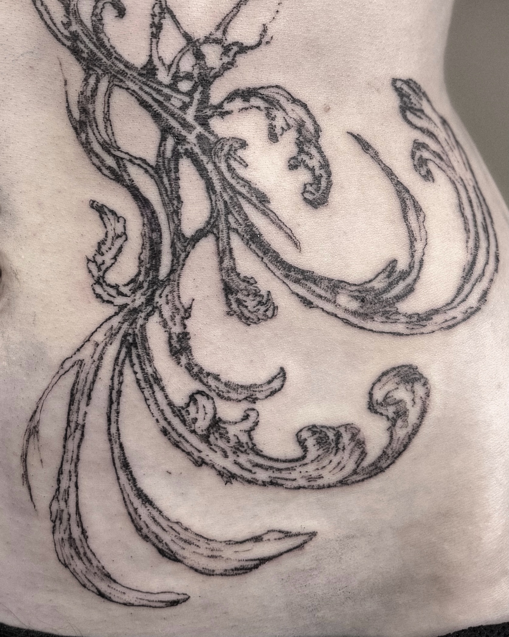 Abstract swirls black and grey tattoo on the torso by ąʑཞąıą ཞąıŋ