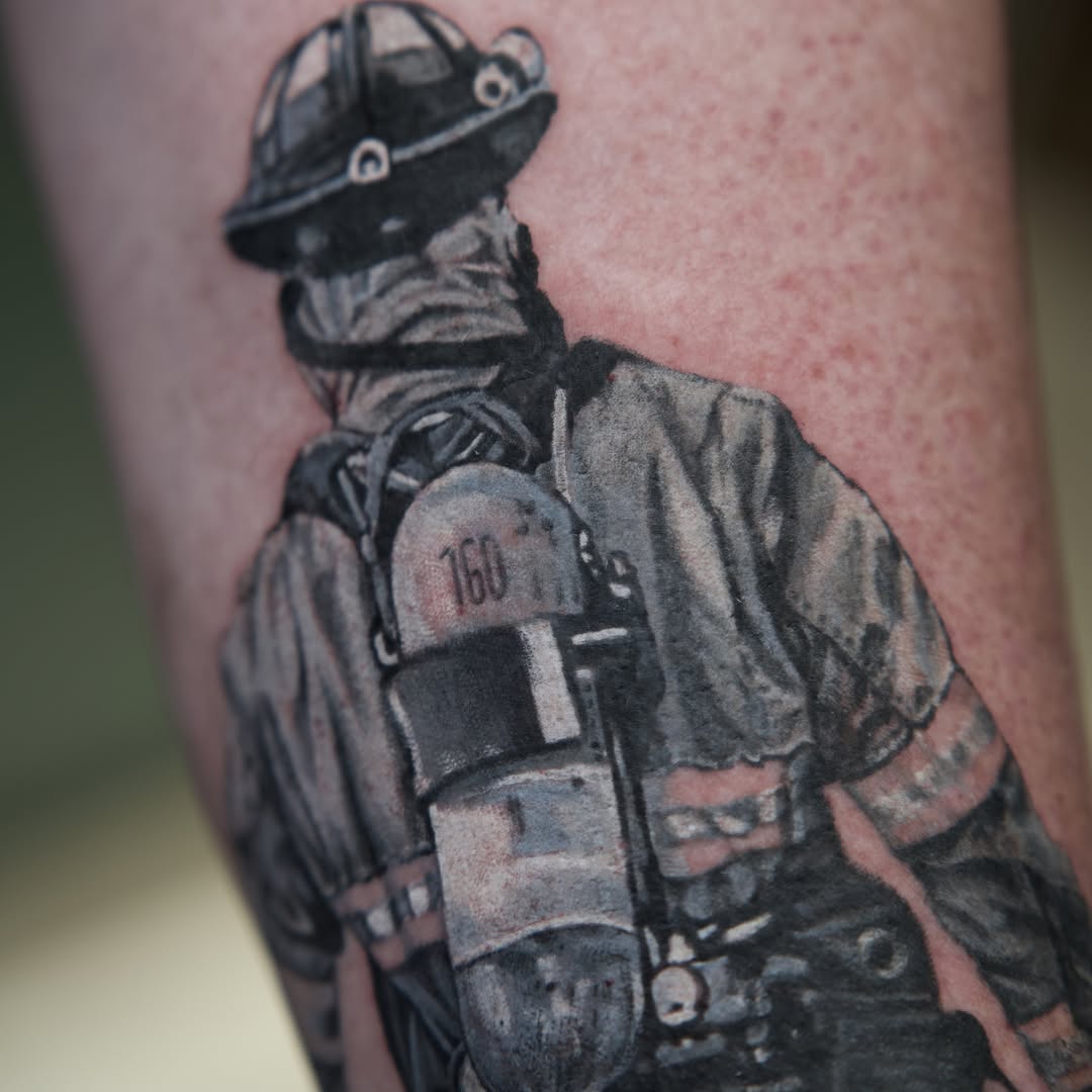 Firefighter realism tattoo on the forearm by Raven Wood