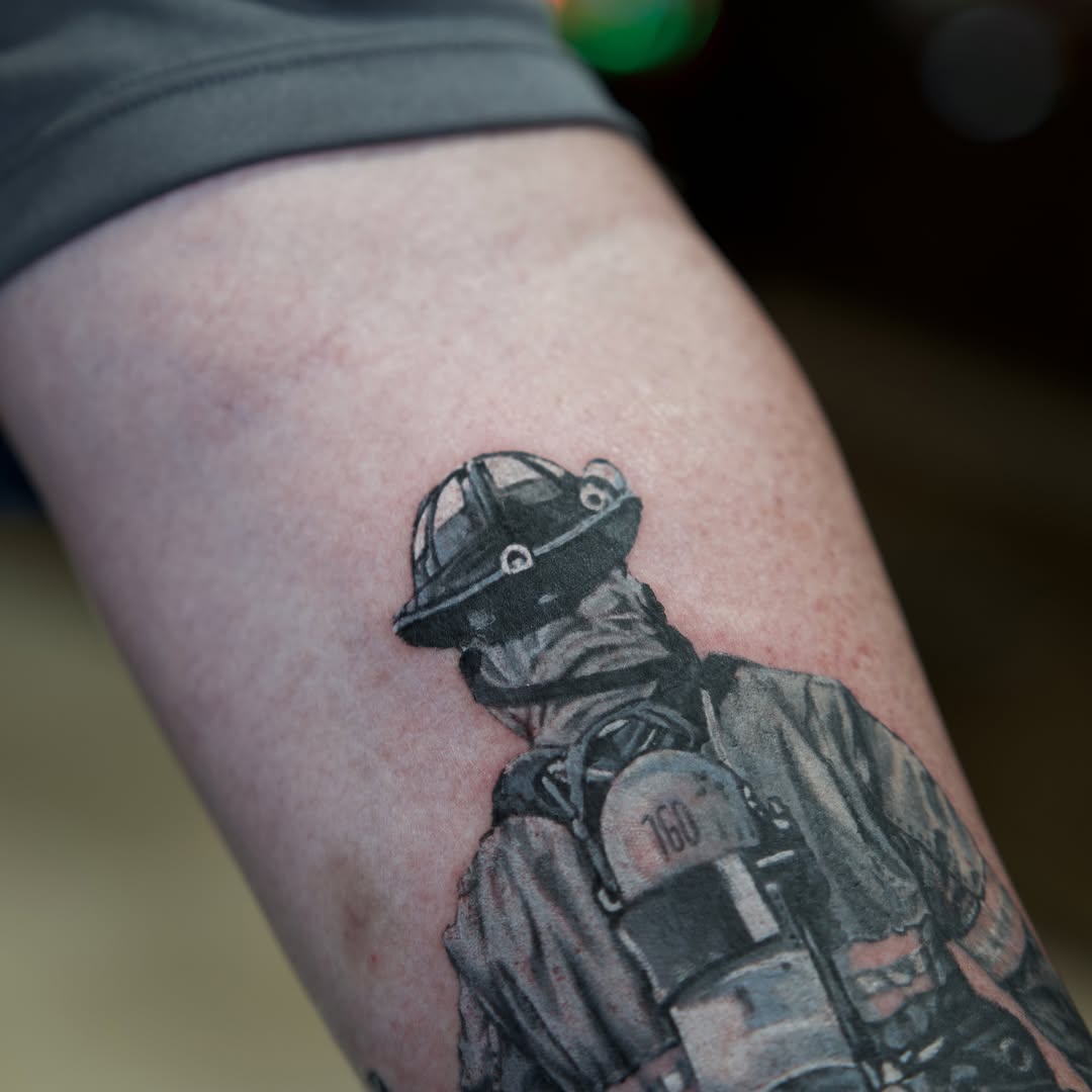 Firefighter realism tattoo on the thigh by Raven Wood