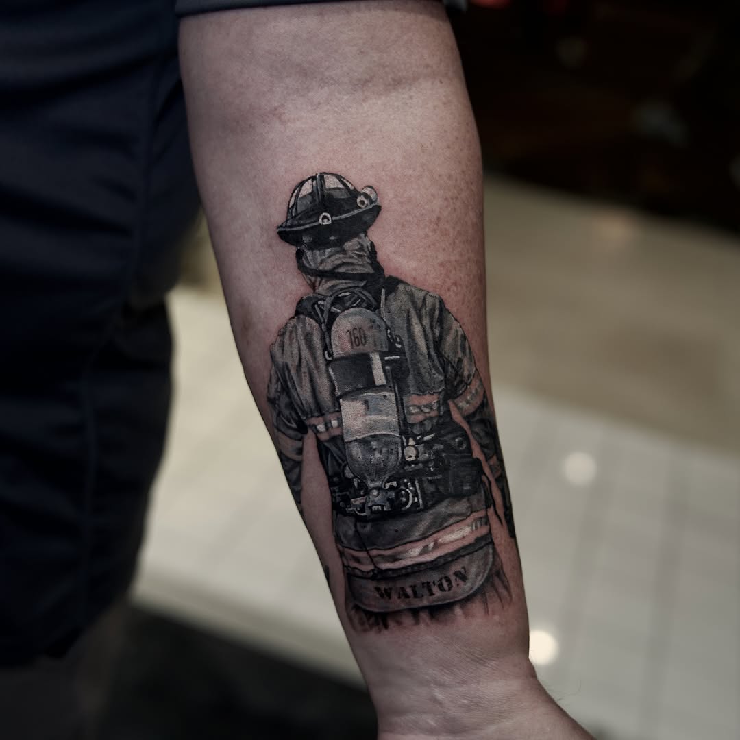 Firefighter realism tattoo on the forearm by Raven Wood