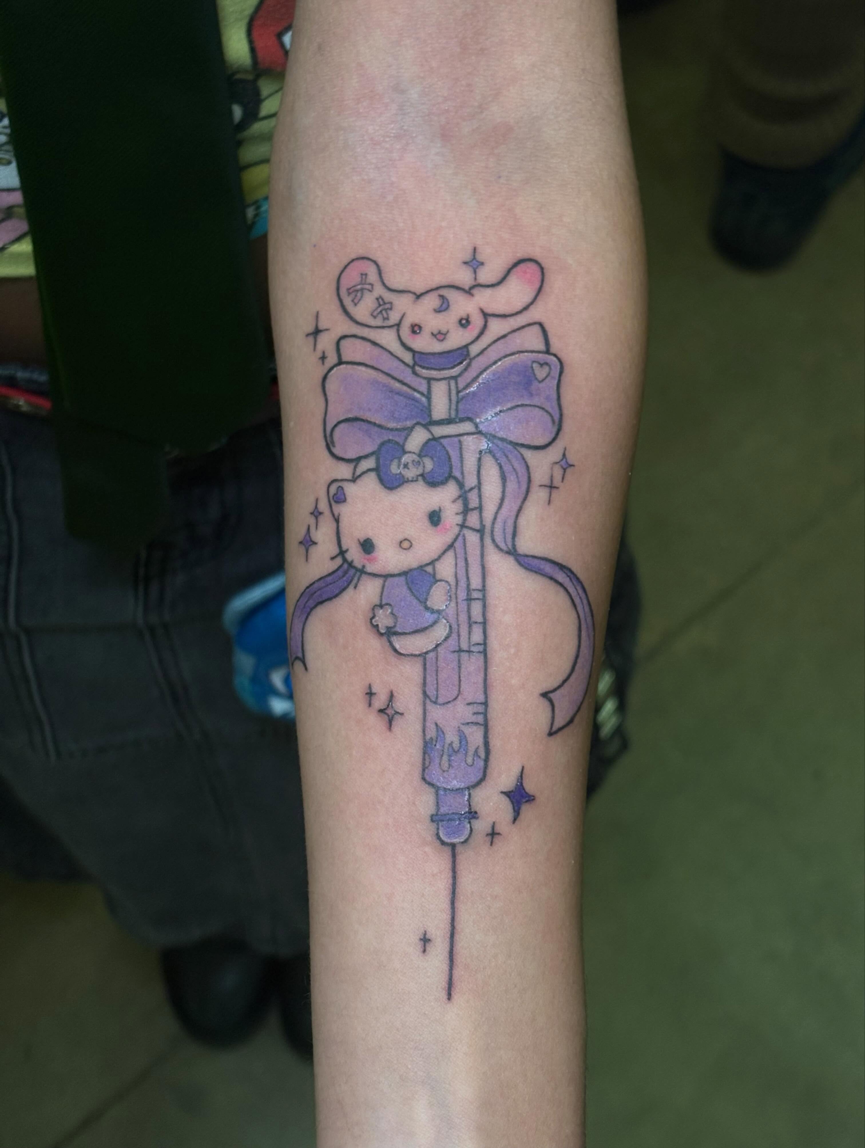 Hello Kitty illustrative tattoo on the forearm by Shampooh