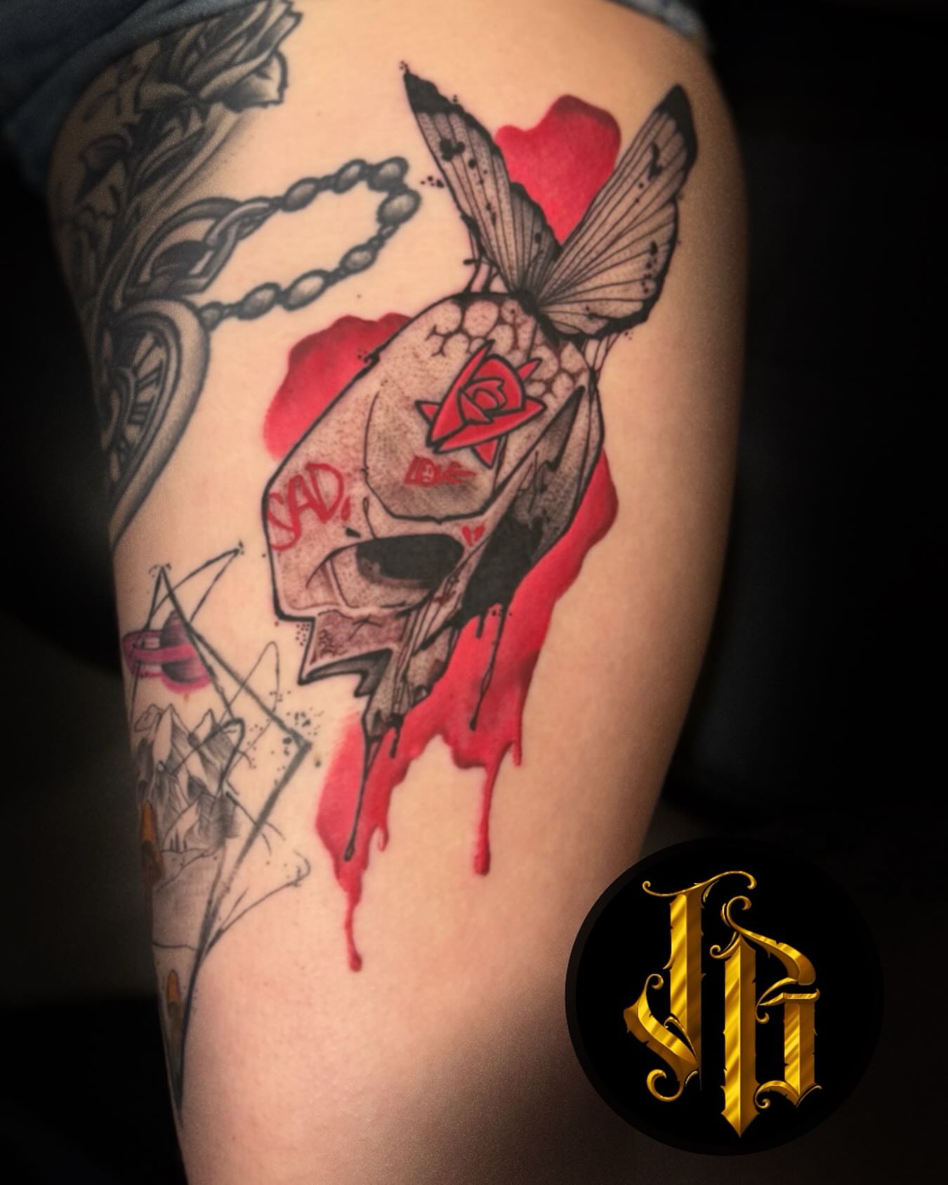 Skull with butterfly dark realism tattoo on the forearm by James Brooks