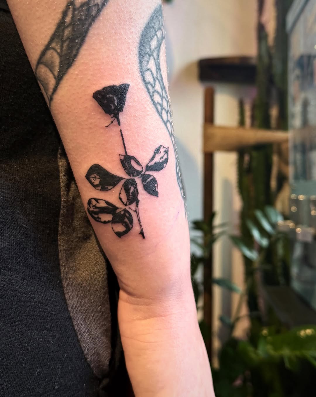 Rose and leaves surrealism tattoo on the forearm by Luna Enriquez⚡️, Portland, Oregon
