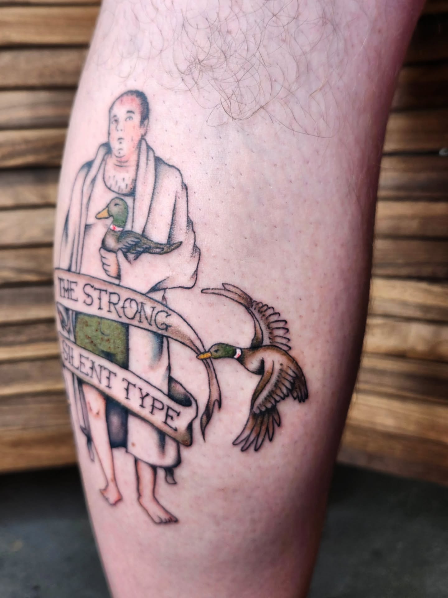 Man with ducks American traditional tattoo on the leg by Kelly Zito
