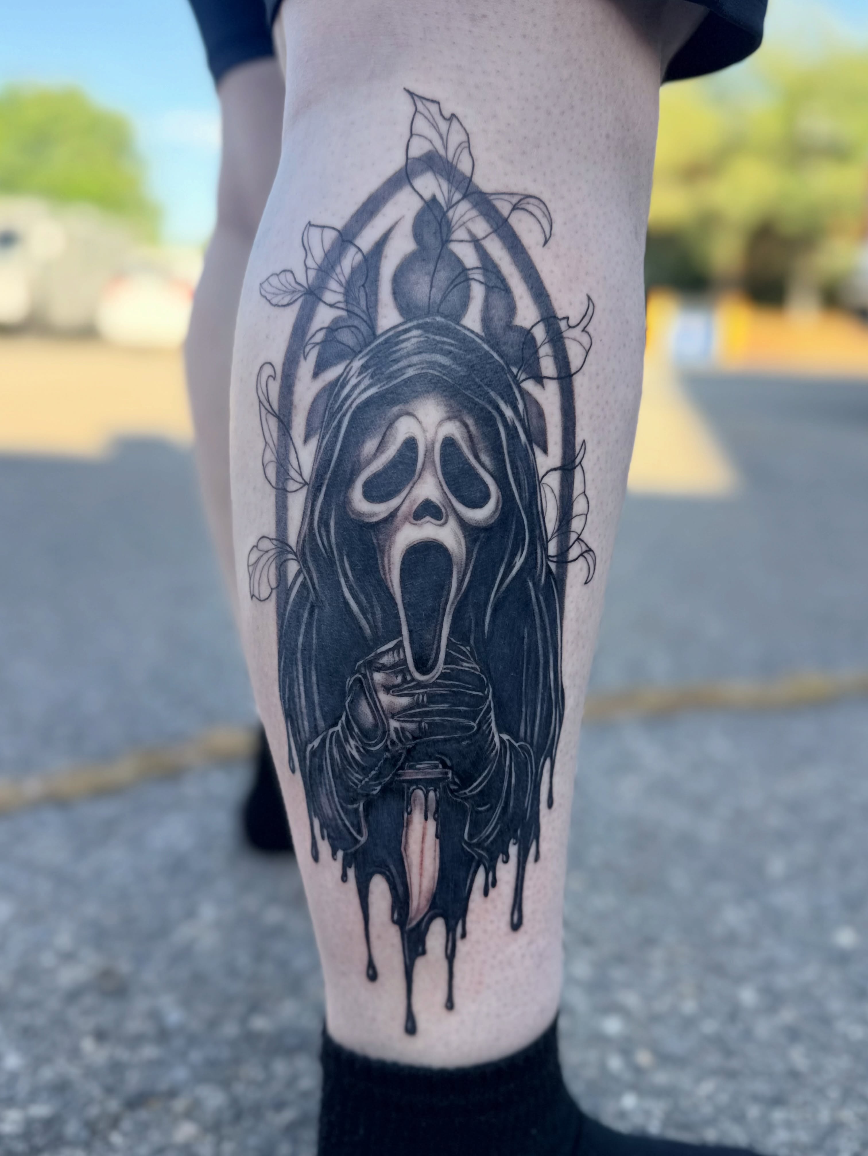 Scream ghost dark realism tattoo on the leg by Maggie George