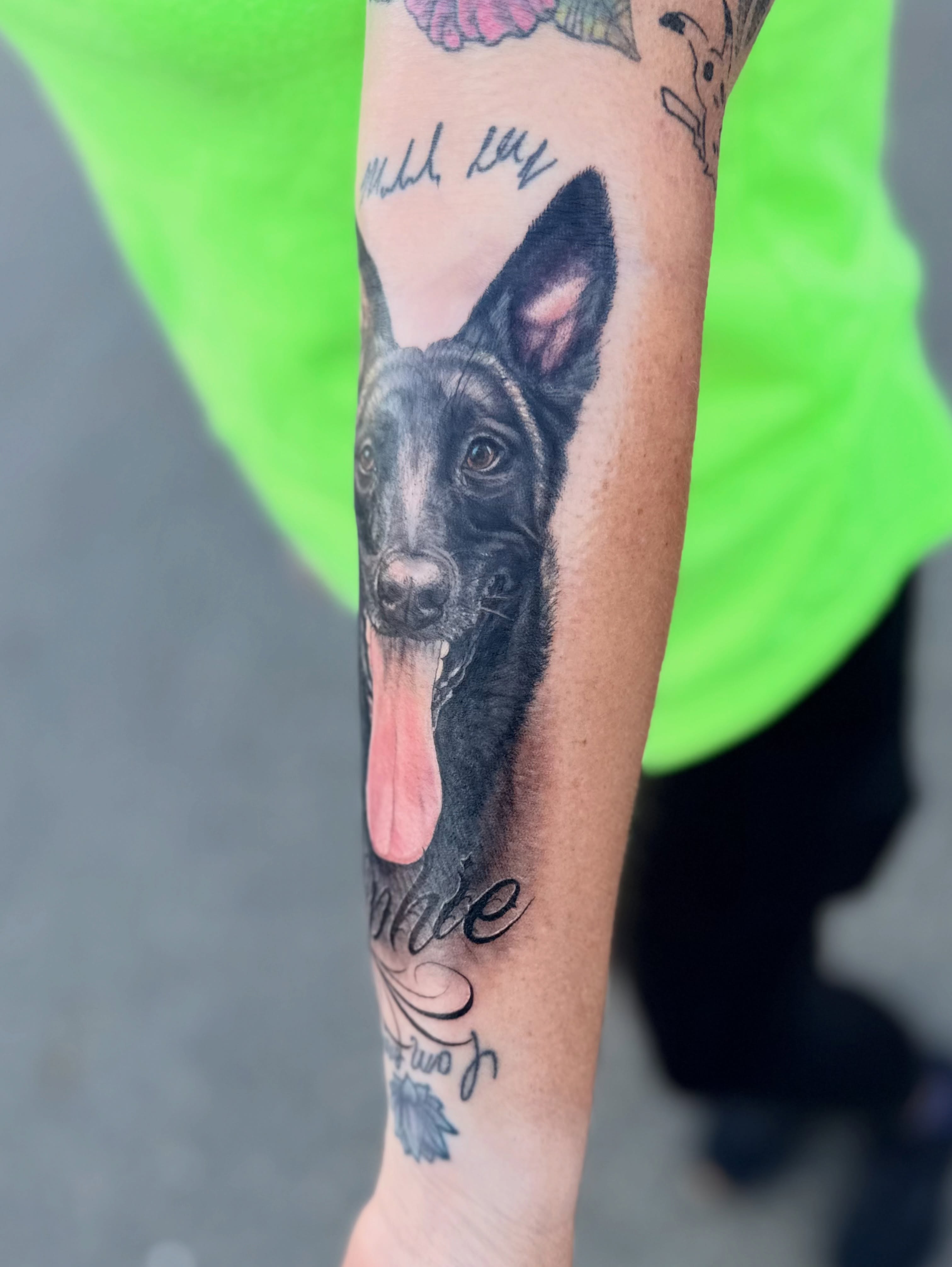 Dog realism tattoo on the forearm by Maggie George