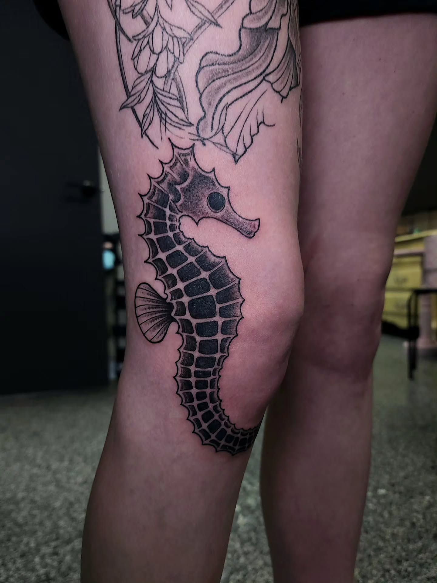 Seahorse black and grey tattoo on the thigh by xavia