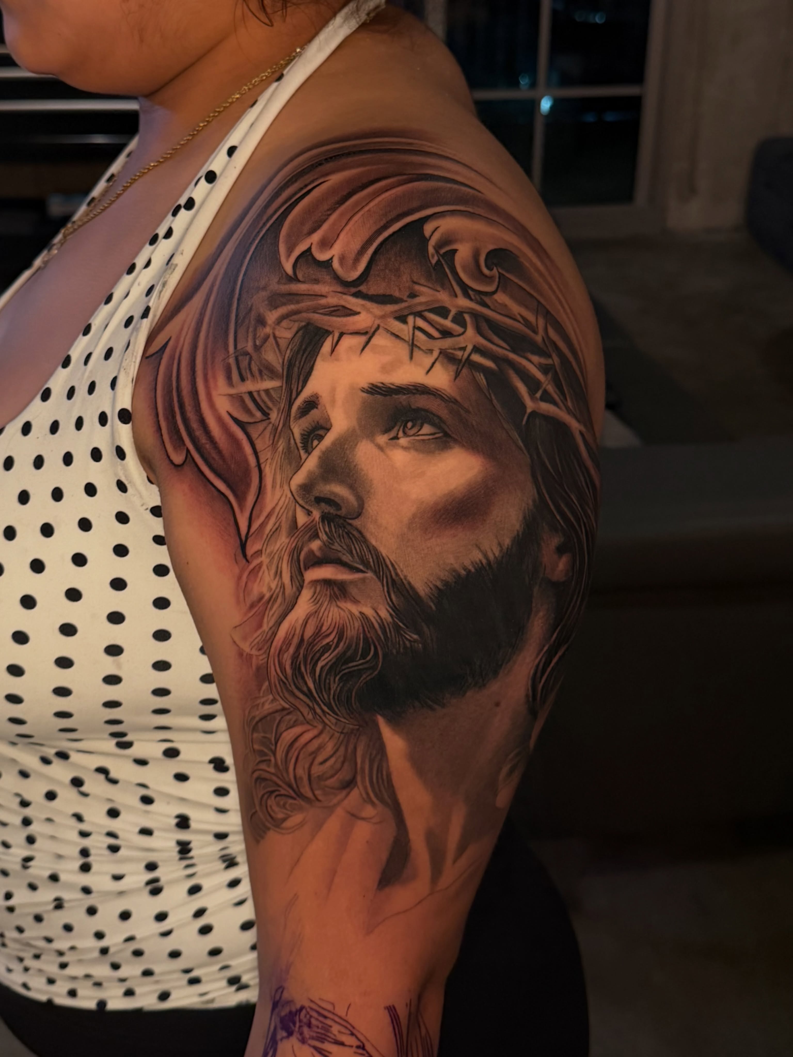 Religious figure realism tattoo on the shoulder by Lemaih Gonzalez