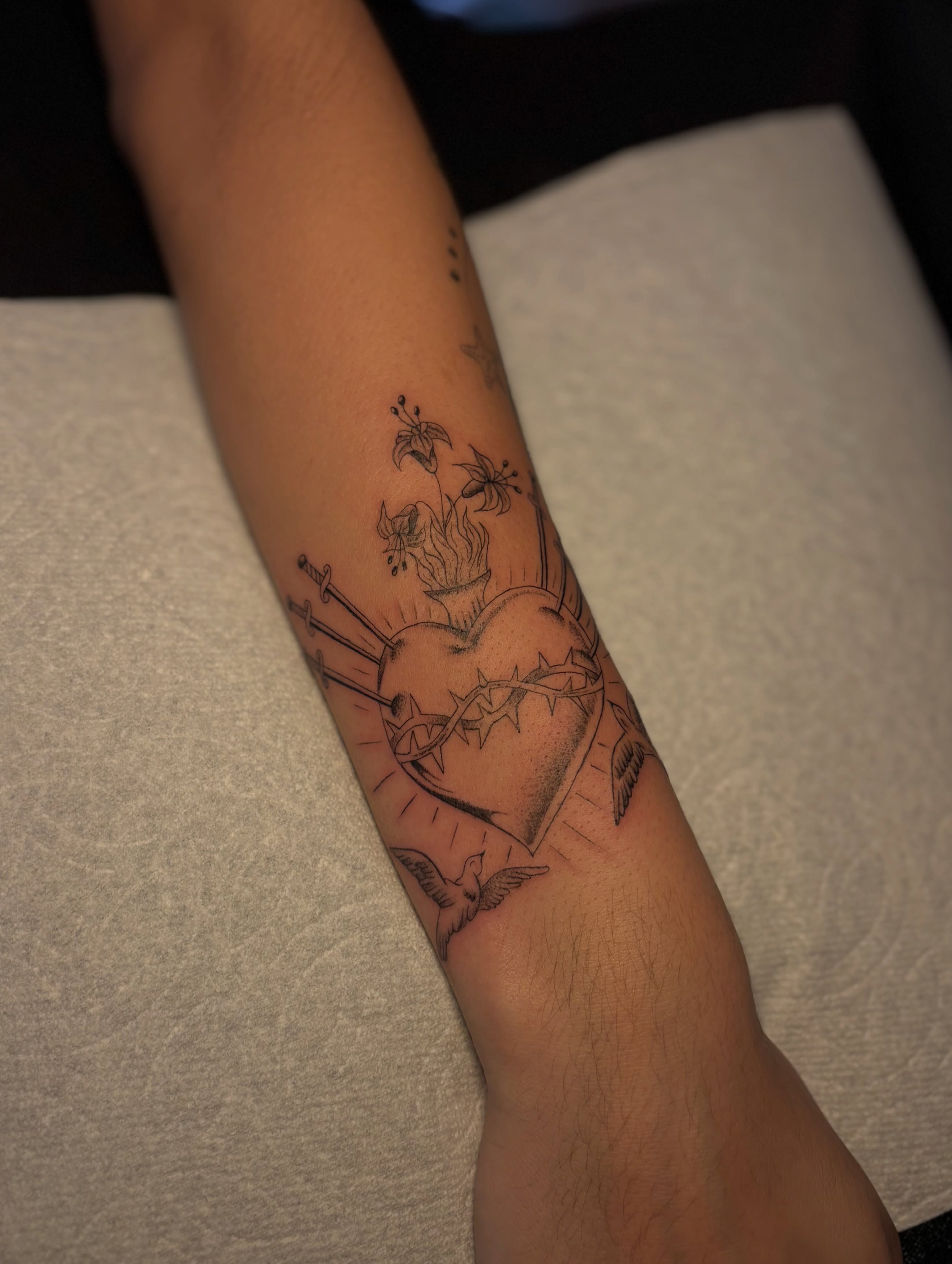 Sacred heart black and grey tattoo on the forearm by the ink witch ๐ฎ๐ค๐