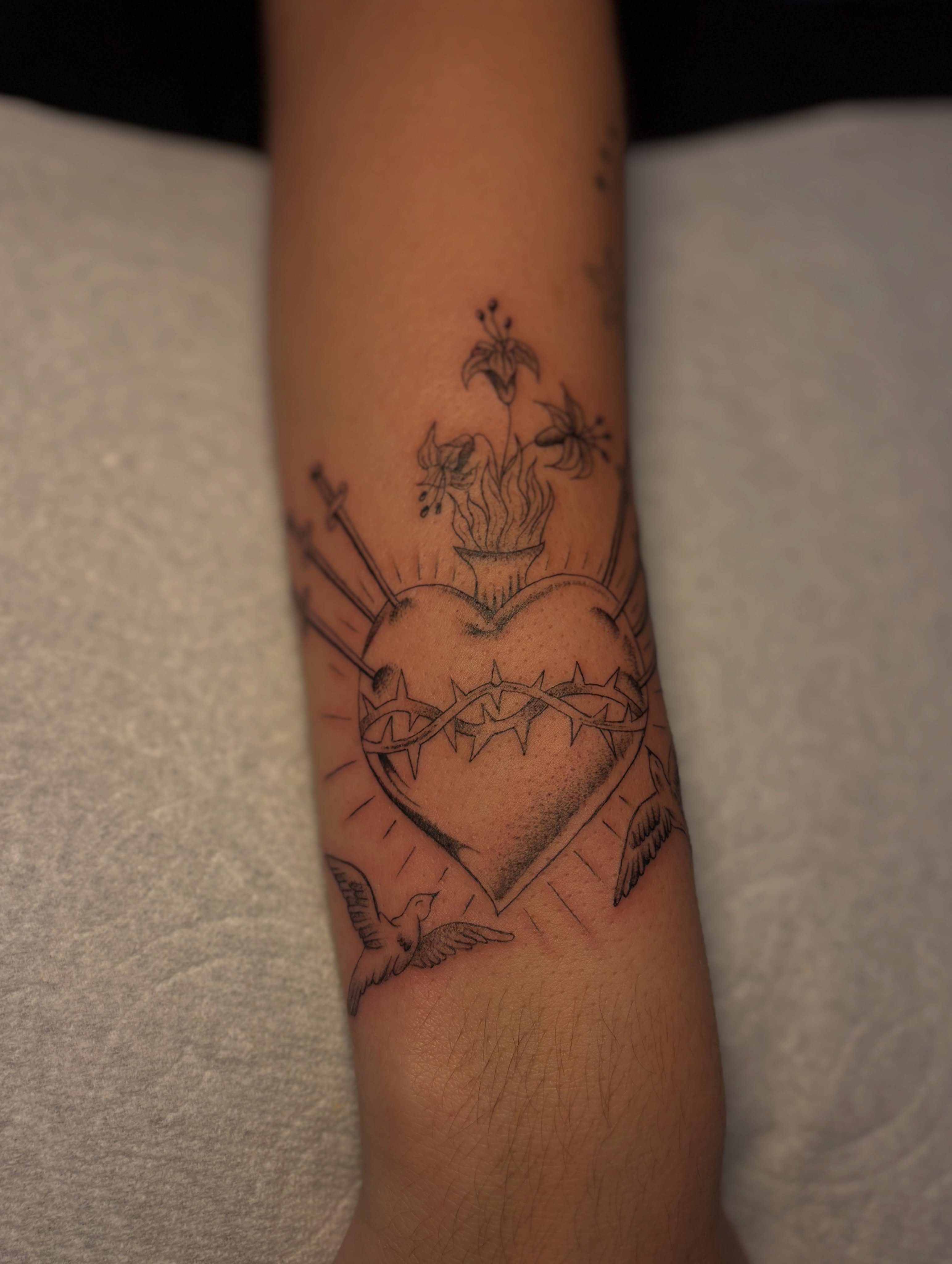 Heart with thorns black and grey tattoo on the forearm by the ink witch ๐ฎ๐ค๐