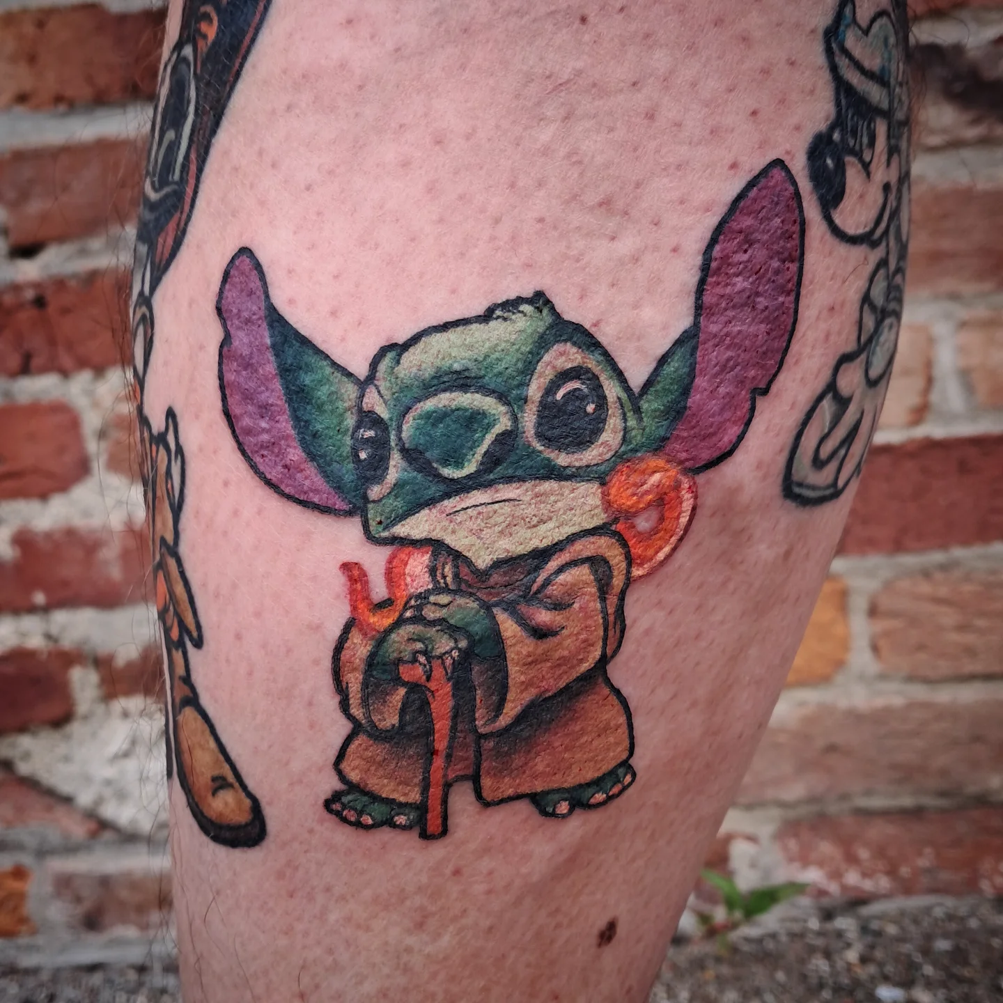 Stitch anime tattoo on the leg by Erika Hollingsworth