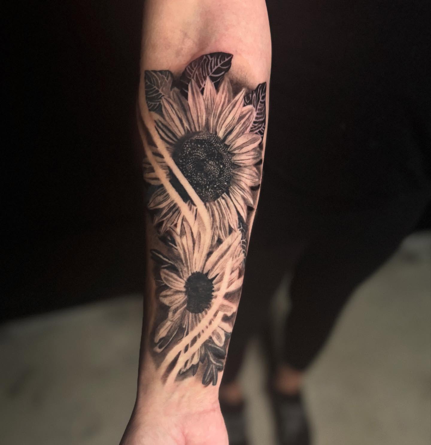 Sunflower realism tattoo on the forearm by Brandiane Wells
