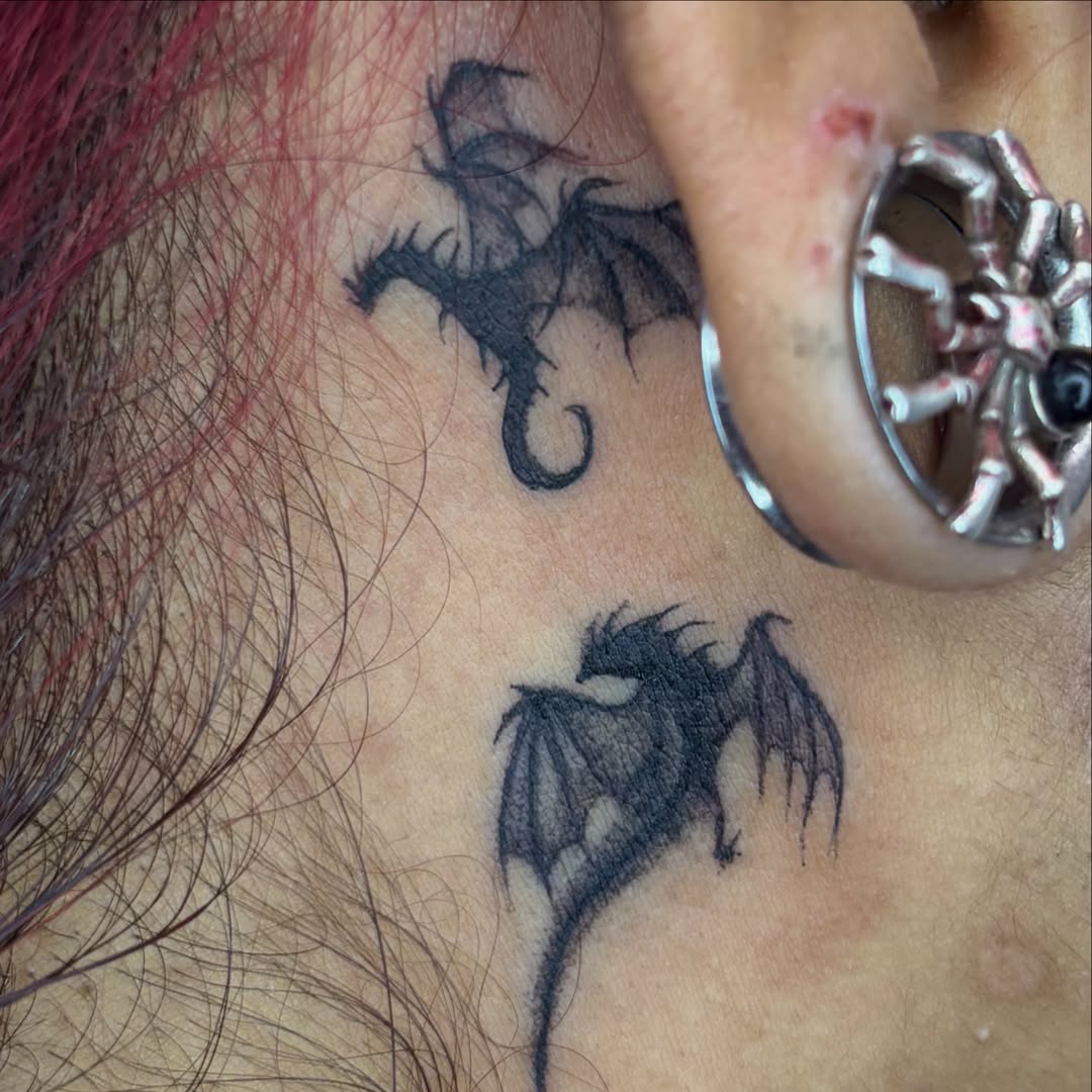 Dragons black and grey tattoo on the neck by Weho Tattoo Artist Lupe