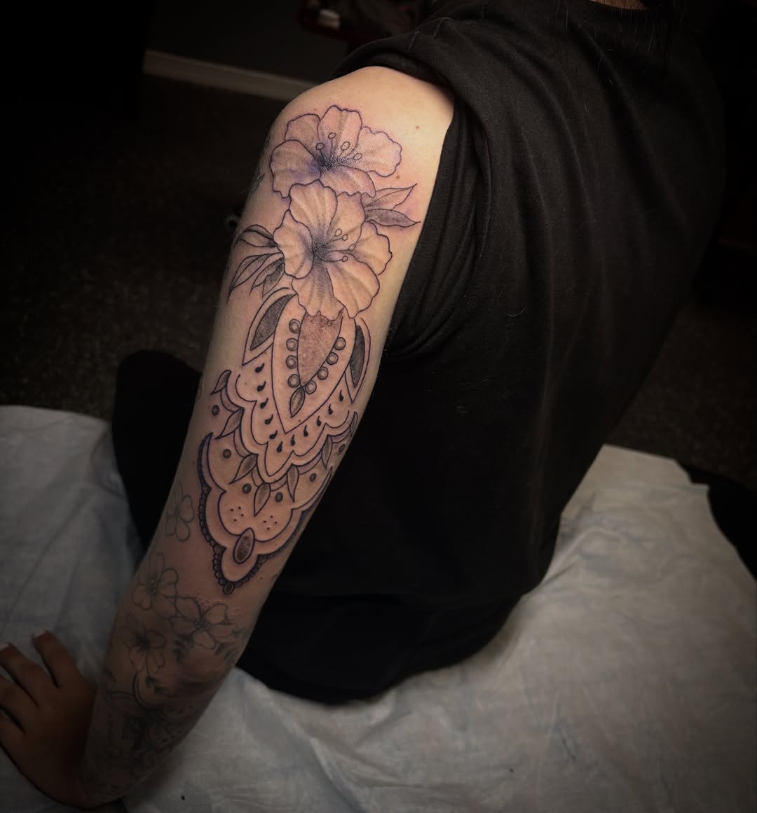 Floral design dotwork tattoo on the forearm by Anastasia Carrasco