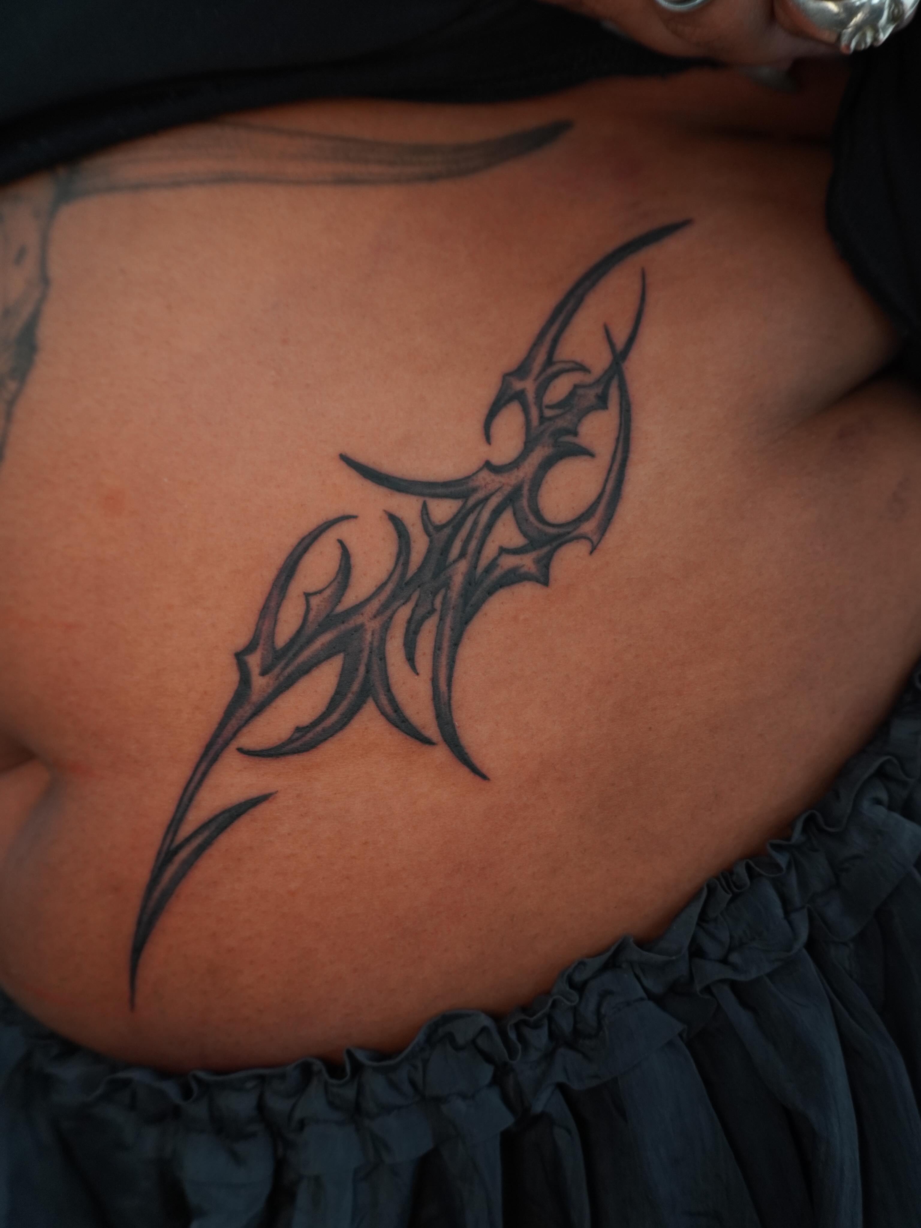 Tribal design tribal tattoo on the ribs by hallow ☣︎ tattoo artist, Philadelphia, Pennsylvania