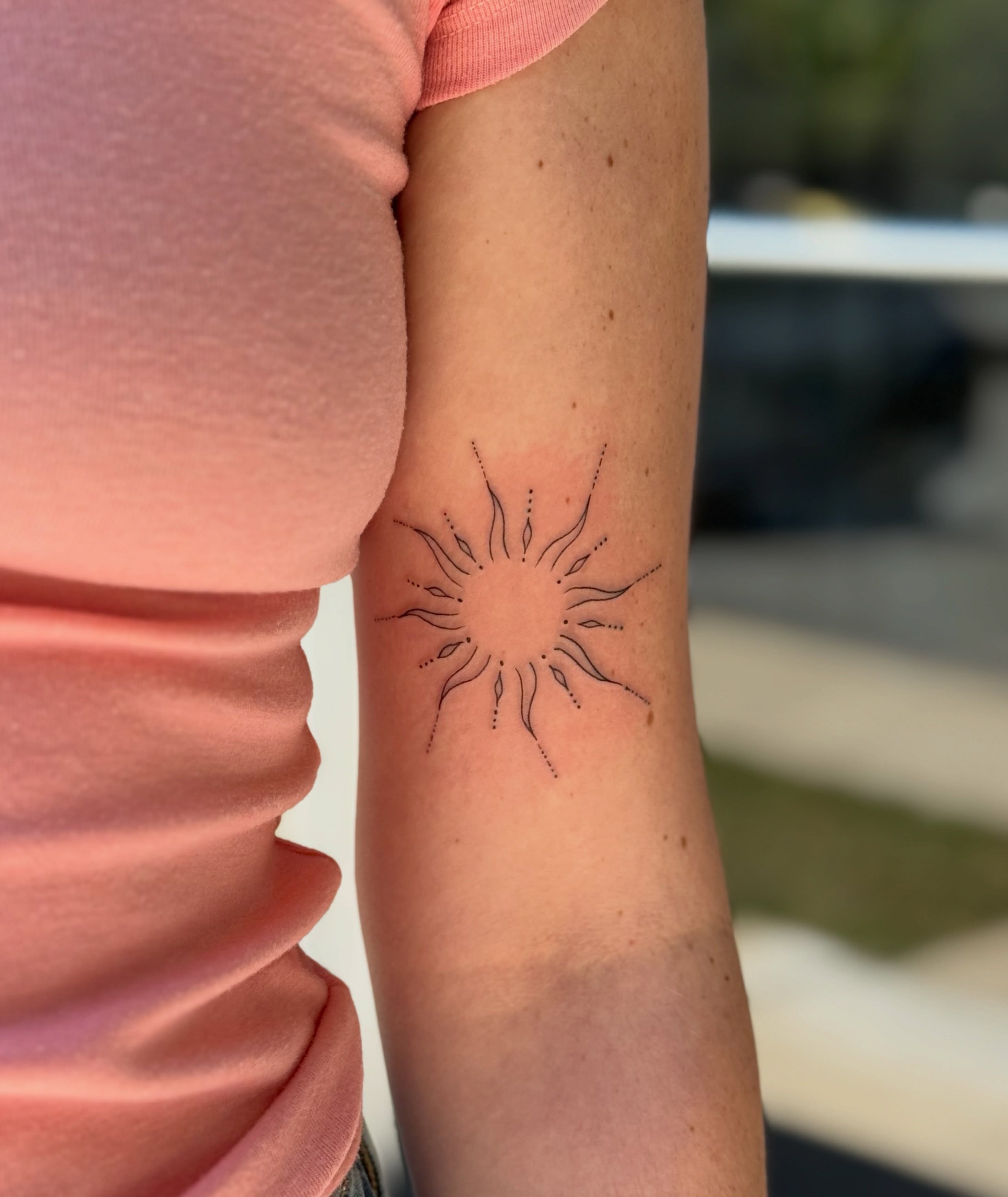 Sunburst dotwork tattoo on the forearm by Emily Velletta, Huntersville, North Carolina