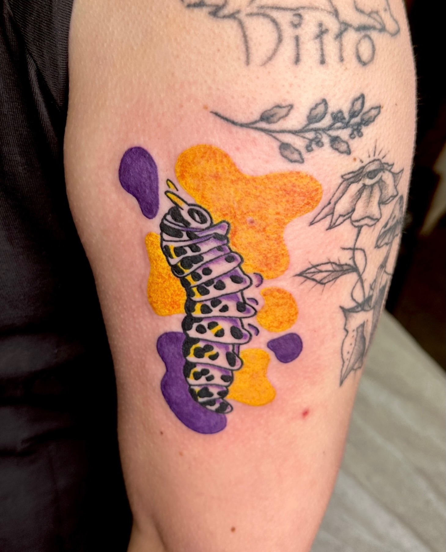 Caterpillar new school tattoo on the forearm by Alexandrea Arendell