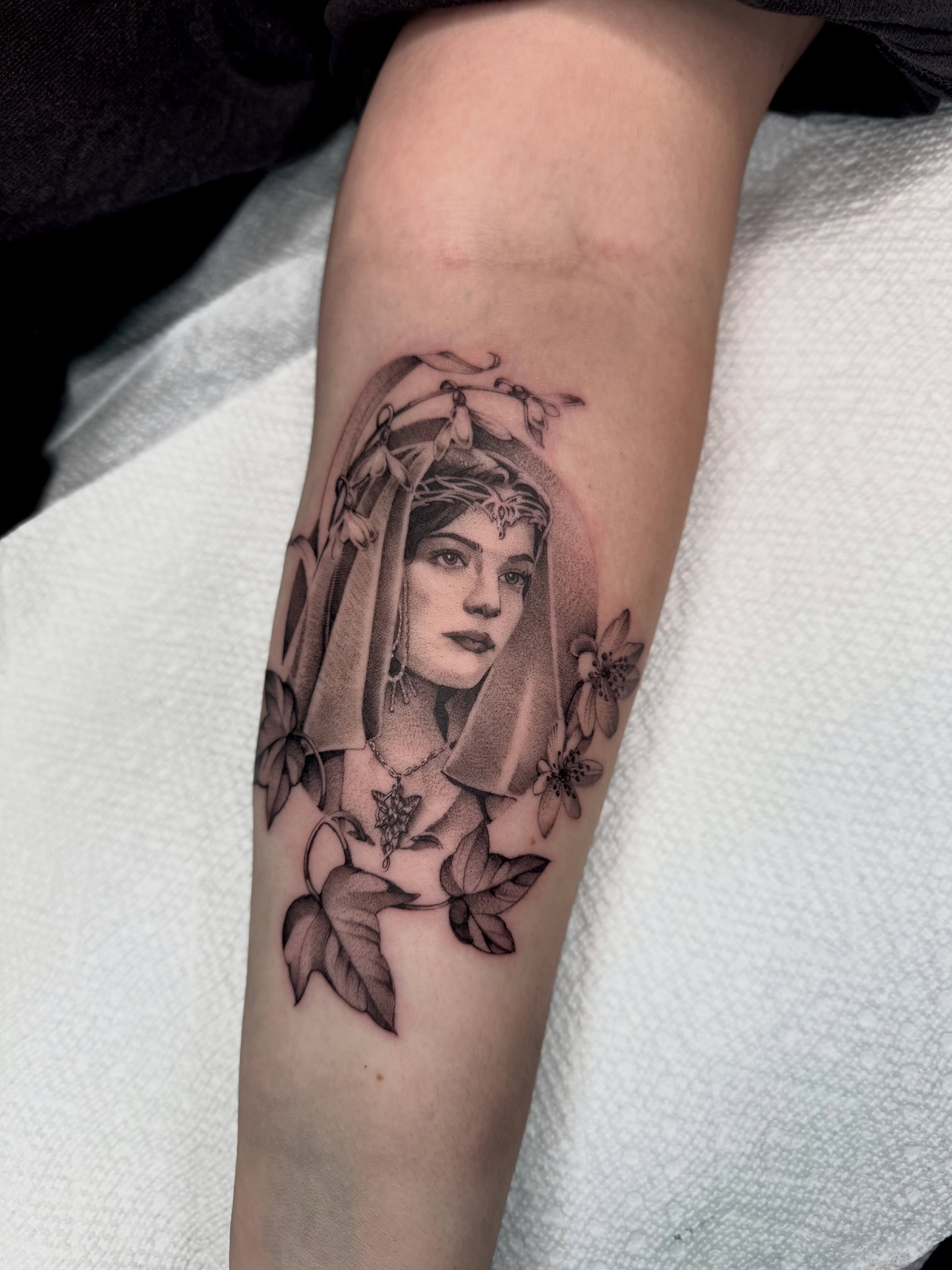 Woman with veil realism tattoo on the forearm by Carla AKA Turnip girl