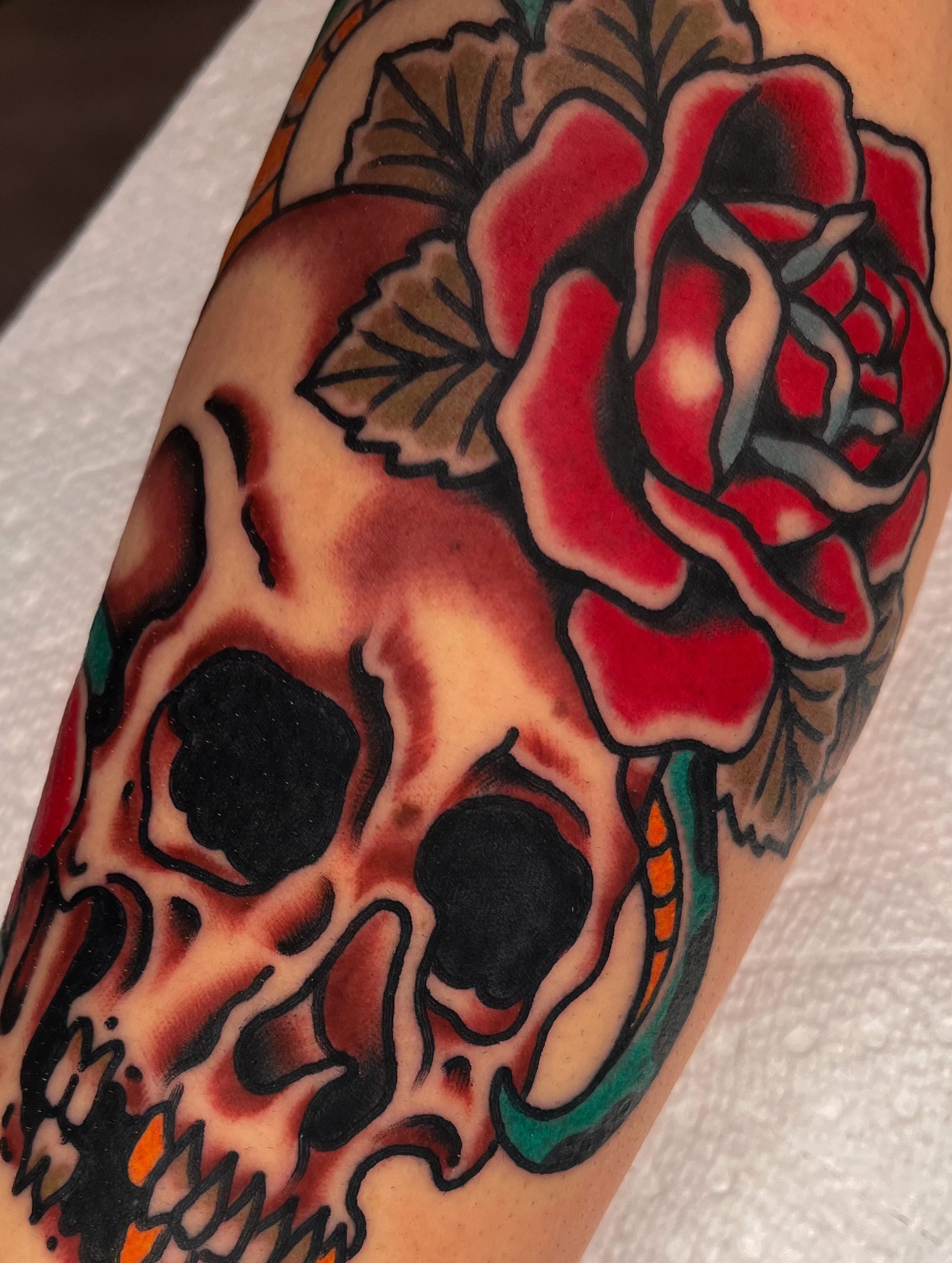 Skull and rose American traditional tattoo on the forearm by Sky G, Colorado Springs, Colorado