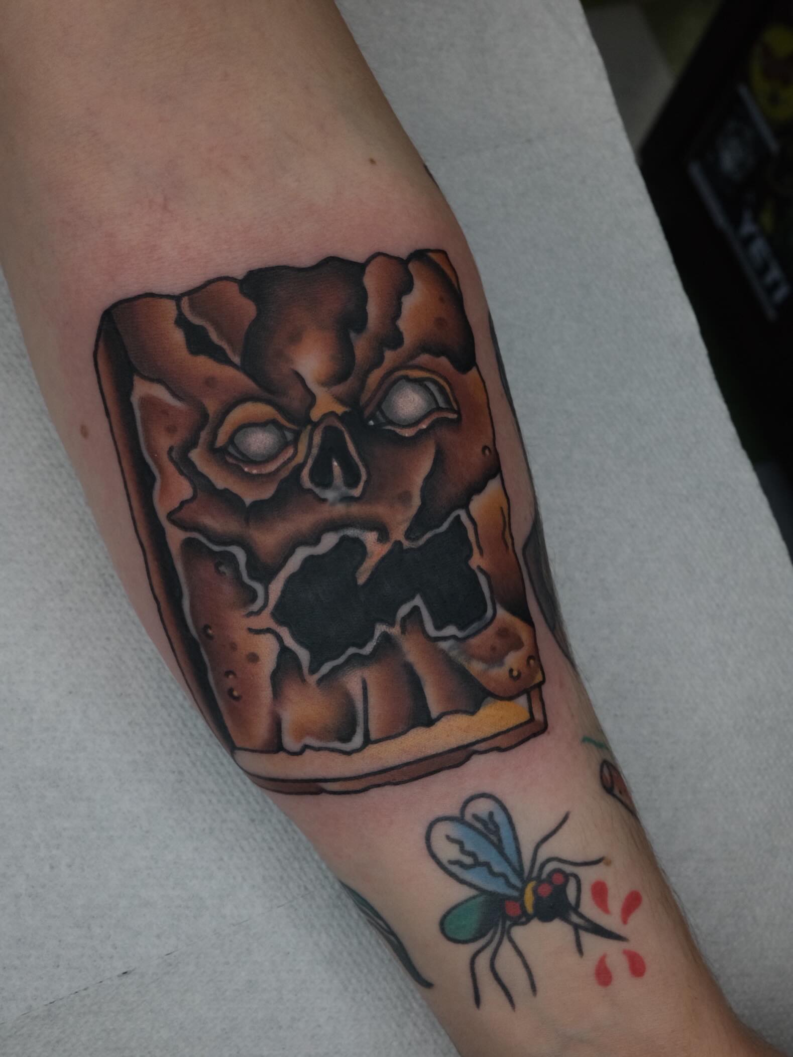 Skull sandwich American traditional tattoo on the forearm by James Maxwell