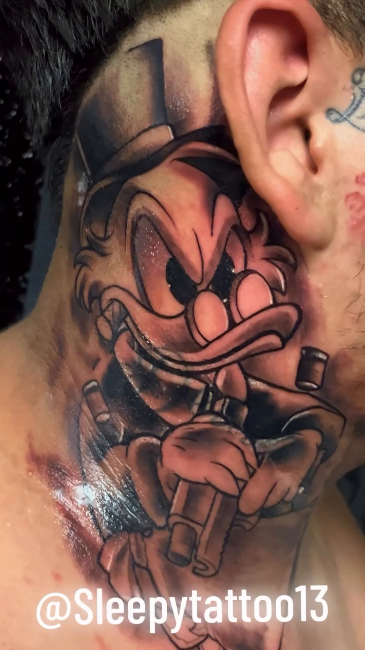 Scrooge McDuck tattoo on neck tattoo on the neck by Brian Cruz Garcia