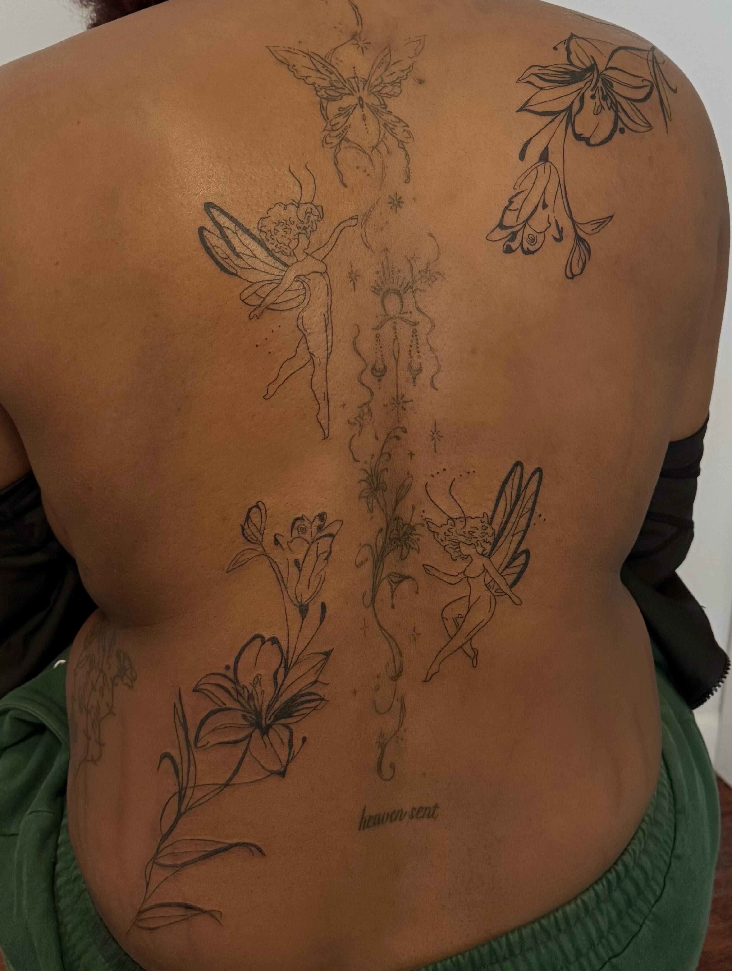 Fairies and flowers black and grey tattoo on the back by Lexie Decker, Canton, Ohio
