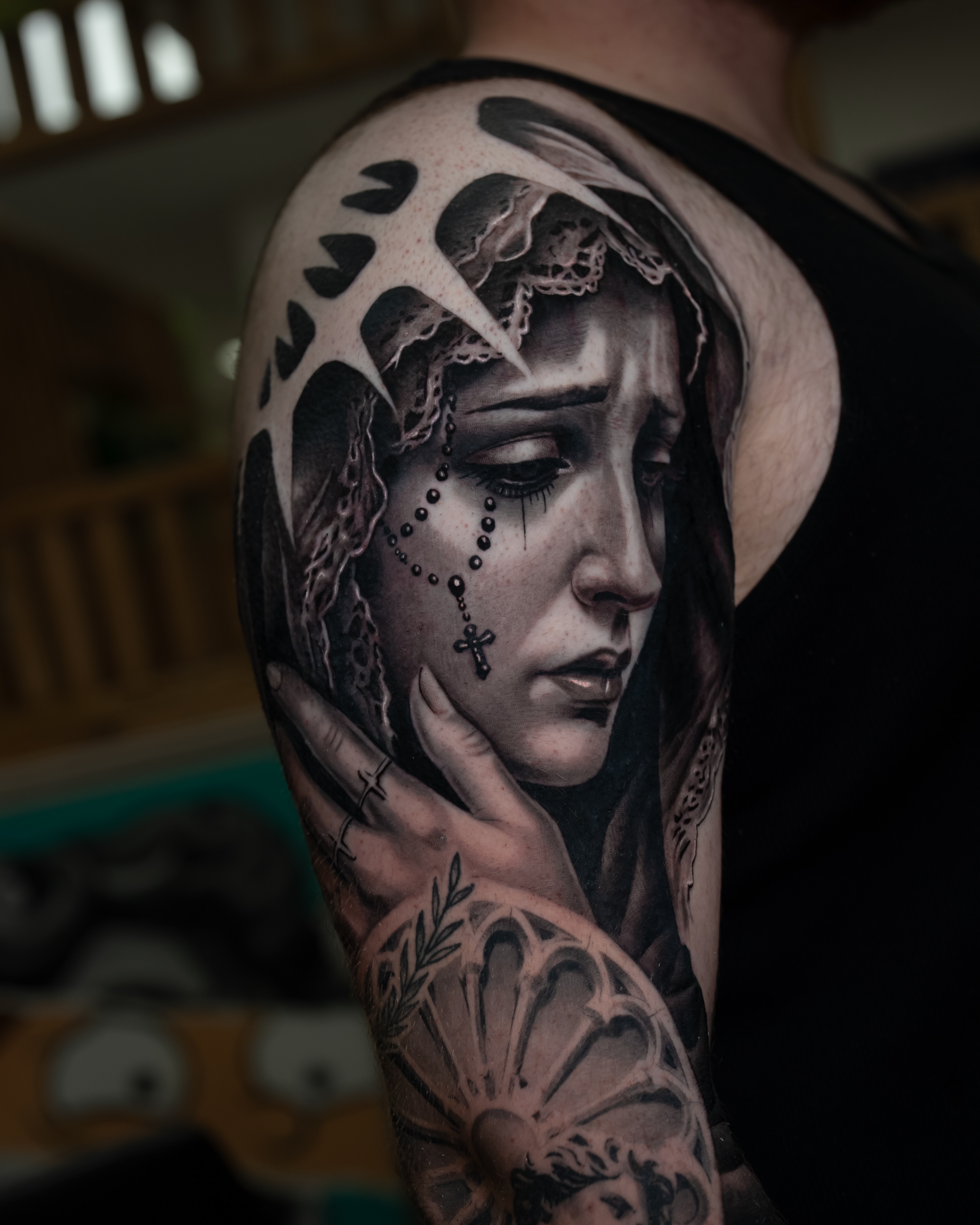 Woman with crown realism tattoo on the shoulder by Javier Chavez