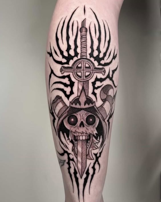 Skull with sword tribal tattoo on the forearm by Brooklyn Bailey
