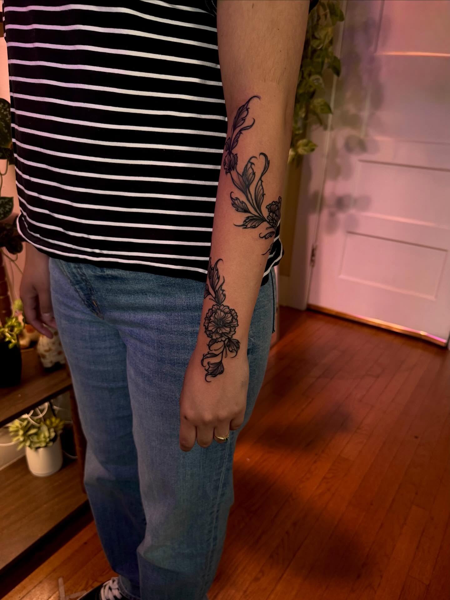 Floral vine black and grey tattoo on the forearm by Angie Cotton