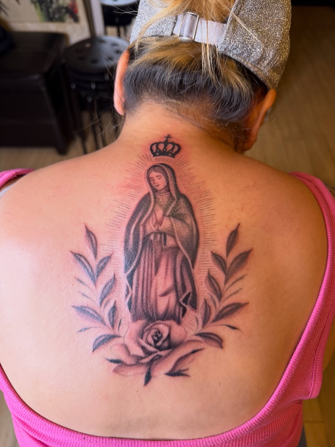 Virgin Mary with rose and leaves Chicano tattoo on the back by Winston Thai