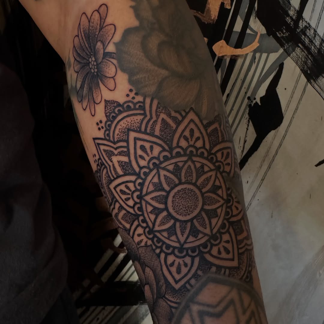 Mandala and flower geometric tattoo on the forearm by Lisa Nikolopoulos, New York, New York