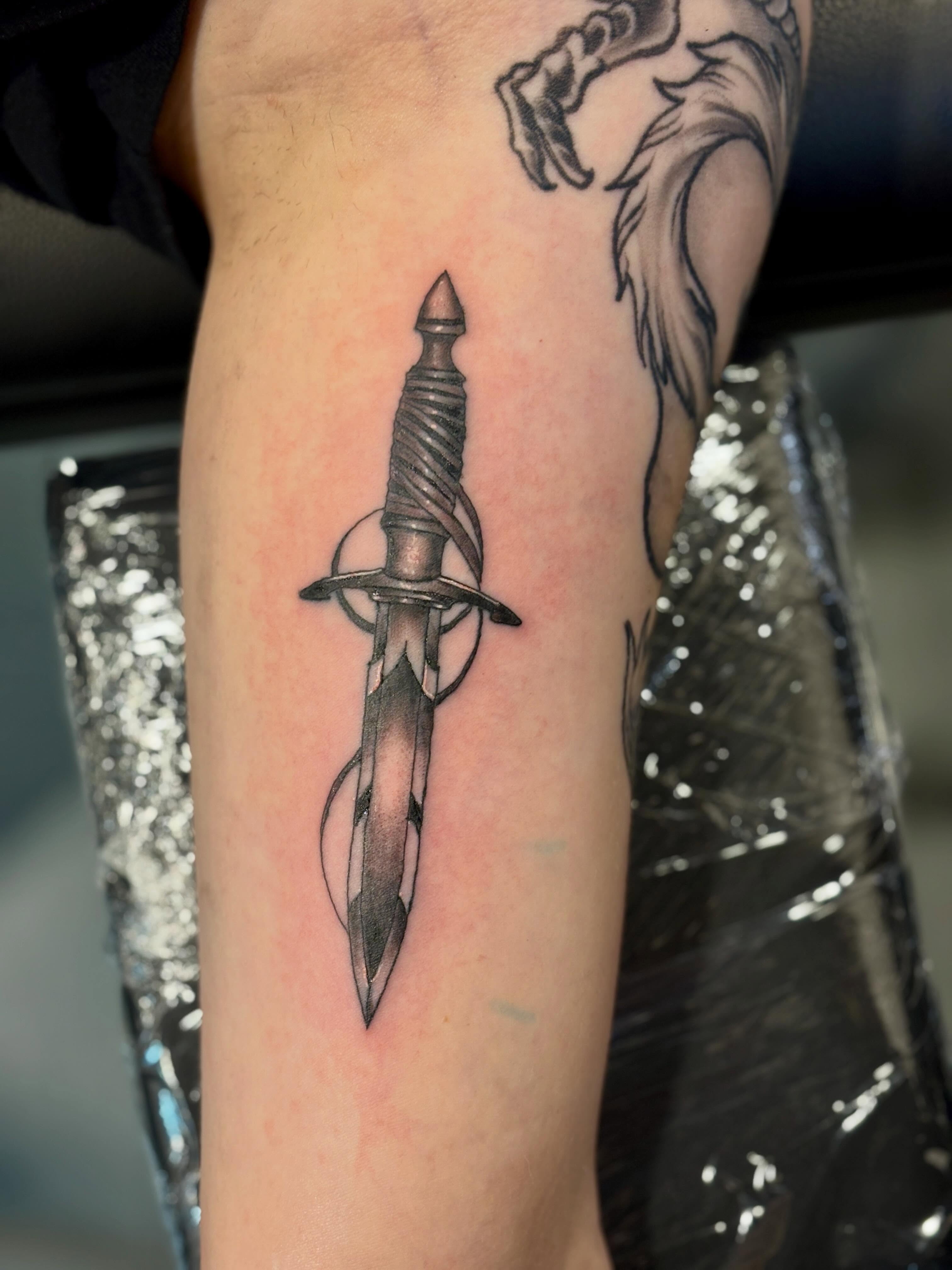 Sword black and grey tattoo on the forearm by Zeninkz