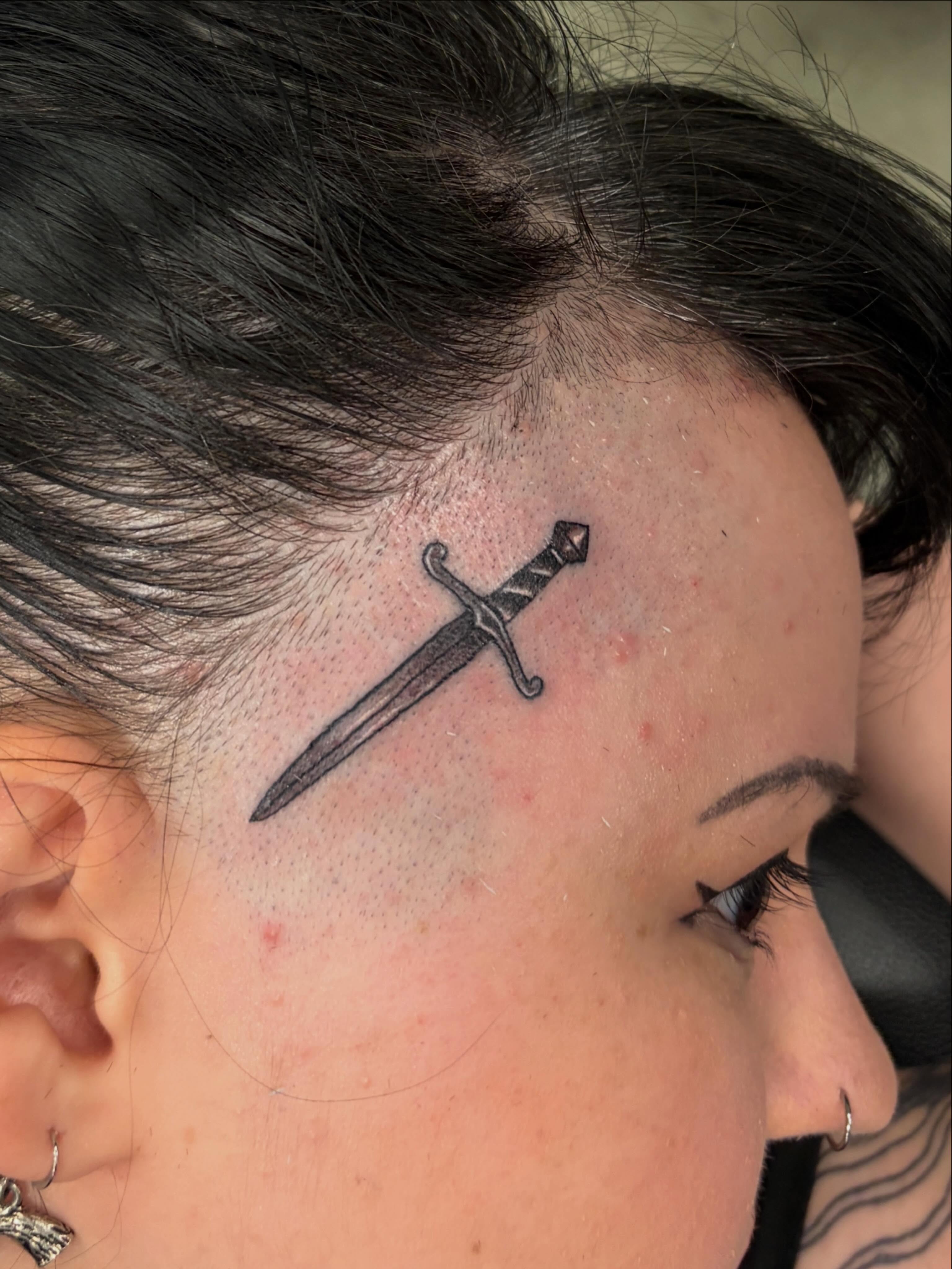 Sword black and grey tattoo on the head by Zeninkz