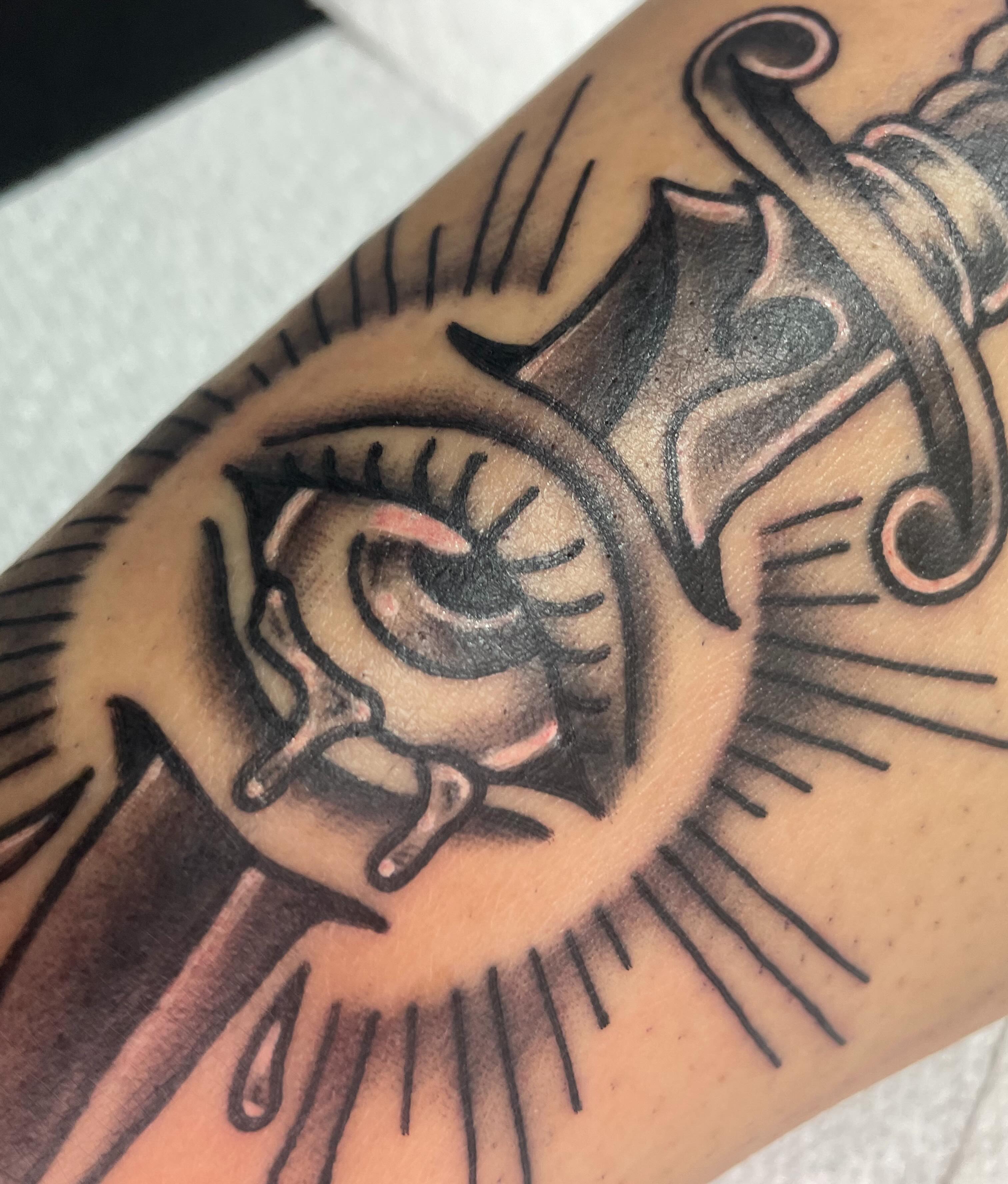 Eye with tears black and grey tattoo on the forearm by Eric (EK) Kuldell
