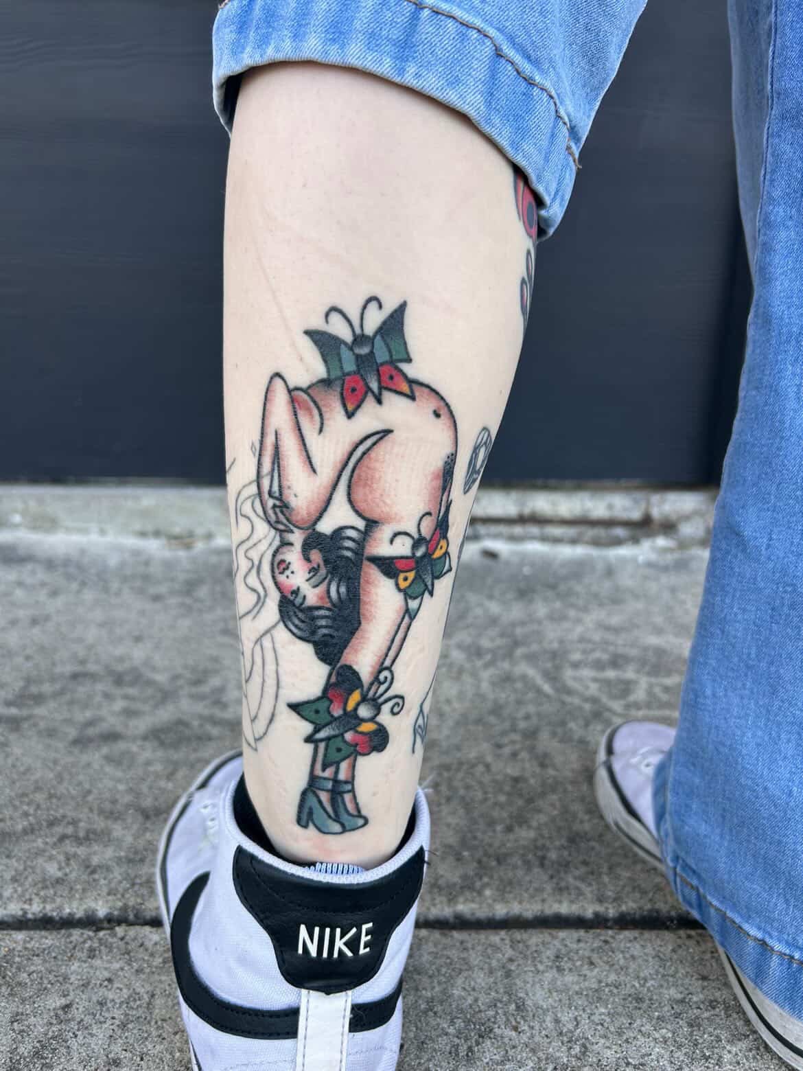 Piglet with bow American traditional tattoo on the forearm by Aaron ulfstam
