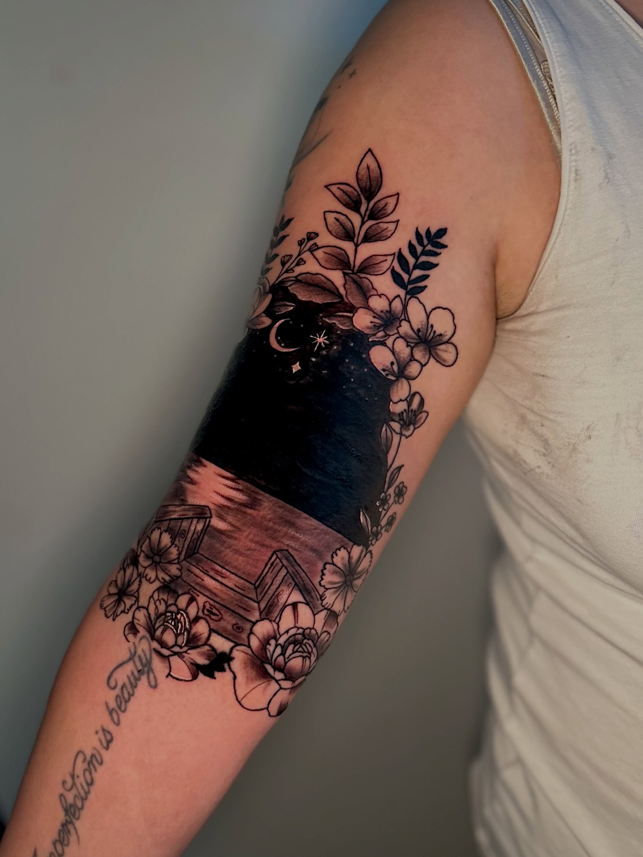 Night sky with flowers realism tattoo on the forearm by AJ