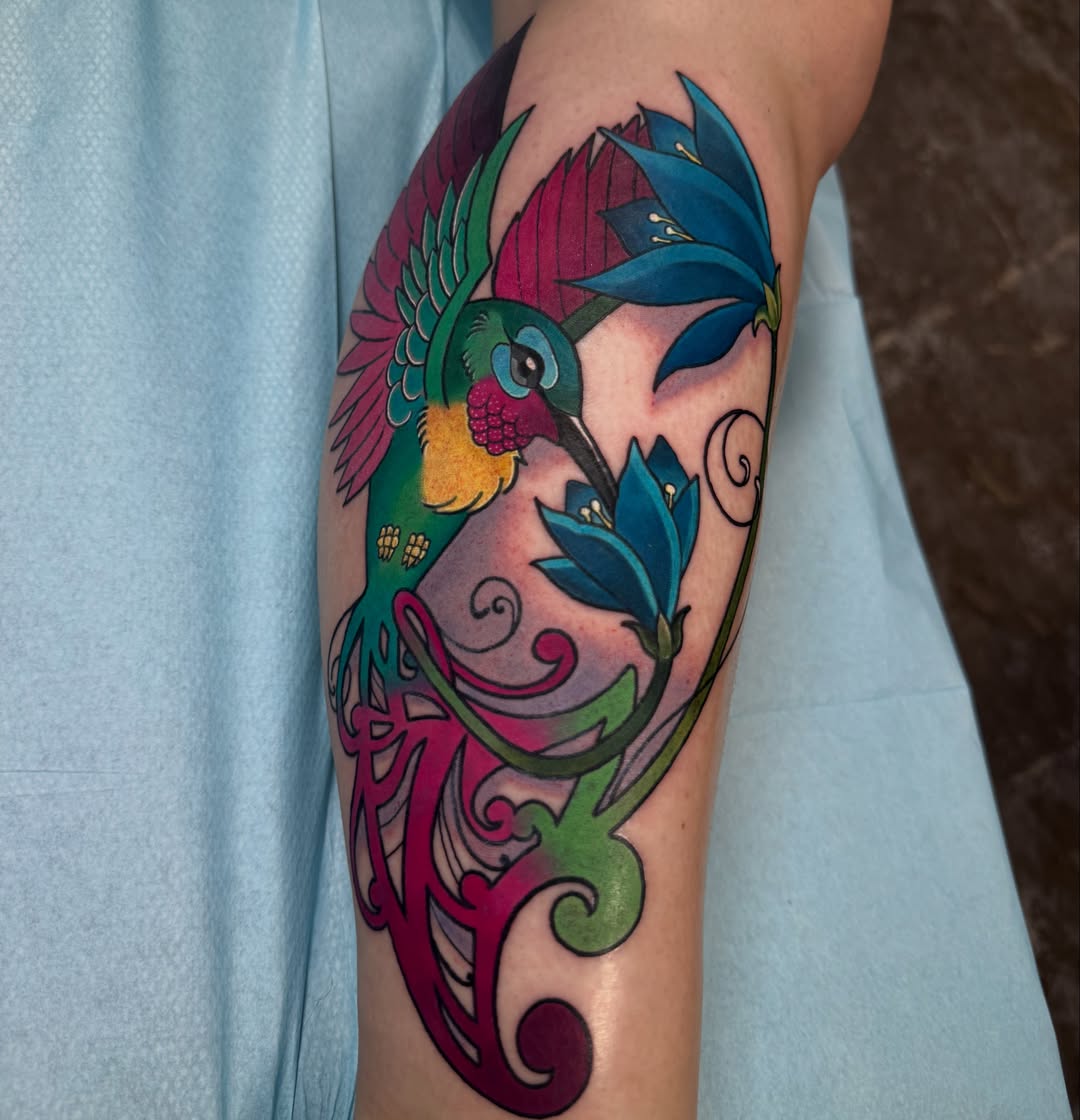 Hummingbird and flowers new school tattoo on the forearm by Rebecca Preble