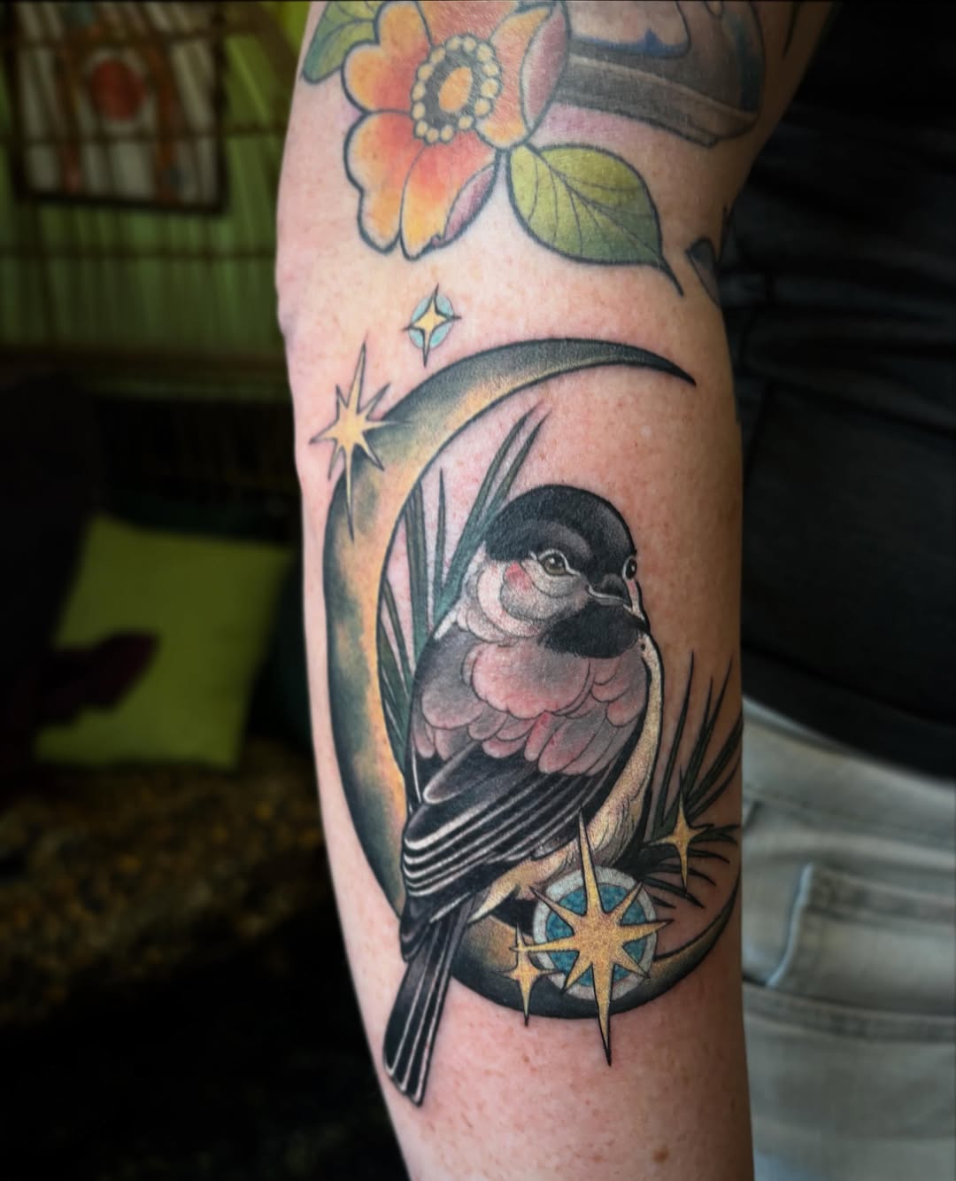 Bird and floral American traditional tattoo on the forearm by Alex