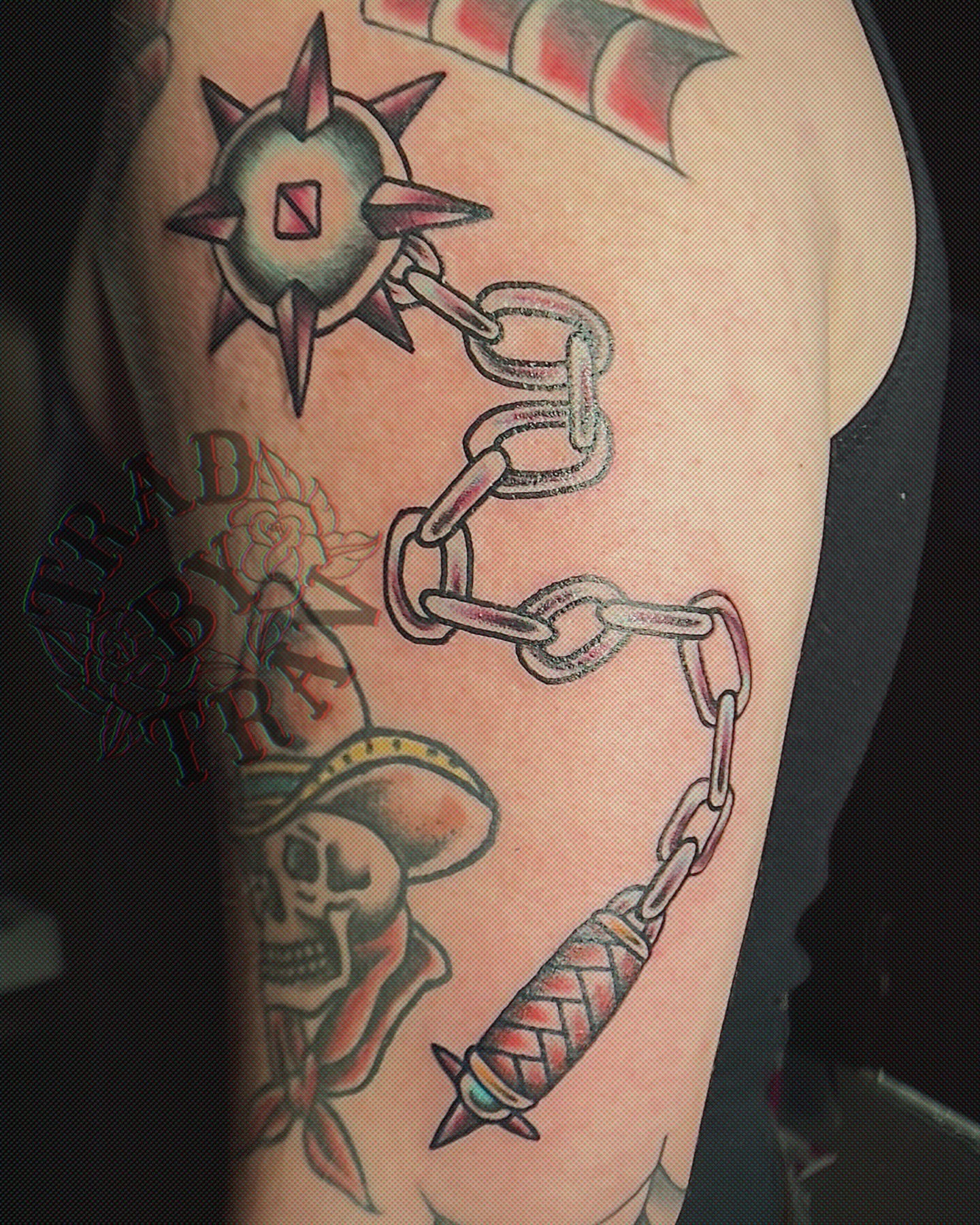 Chains and skull American traditional tattoo on the forearm by Travis B