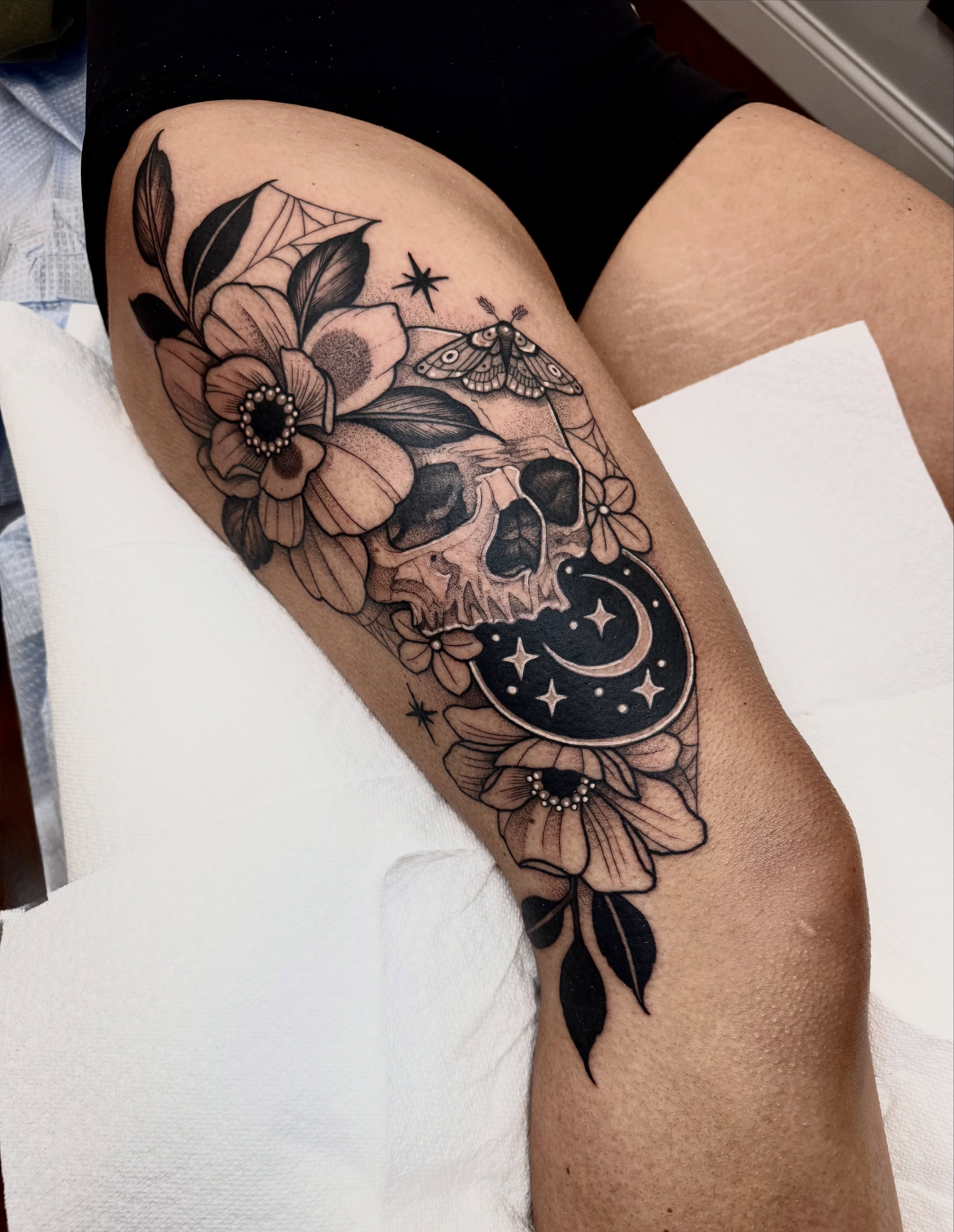 Skull and flowers realism tattoo on the thigh by ⚡️ Krissy Fabis ⚡️