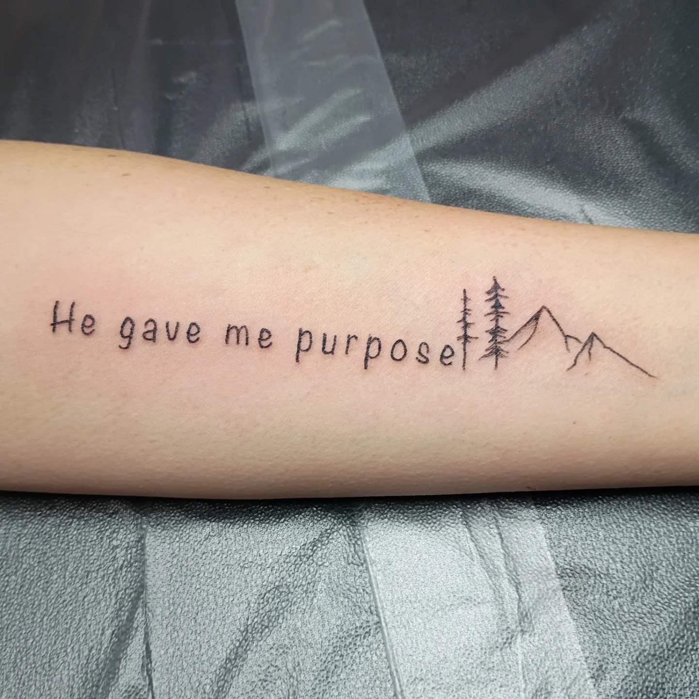 He gave me purpose lettering script tattoo on the forearm by Tiffany